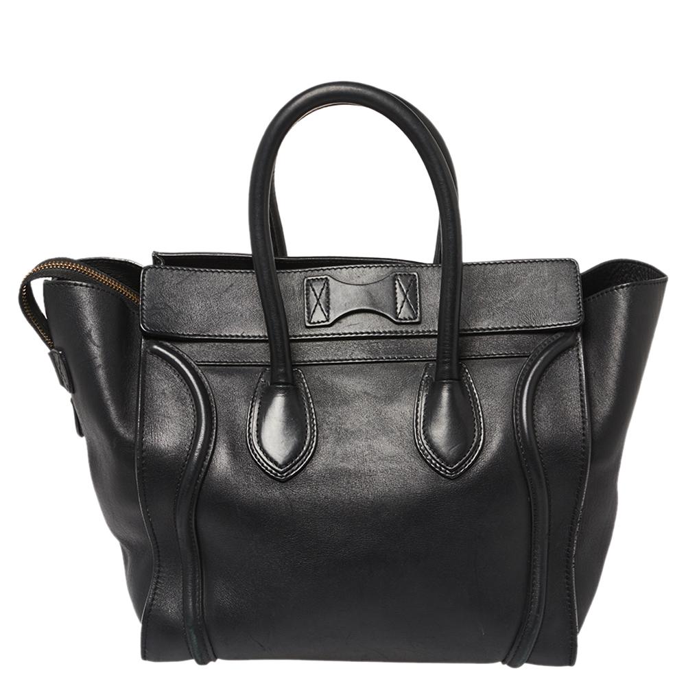 The mini Luggage tote from Celine is one of the most popular handbags in the world. This tote is crafted from leather and designed in a black shade. It comes with rolled top handles and a front zip pocket. The bag is equipped with a well-sized