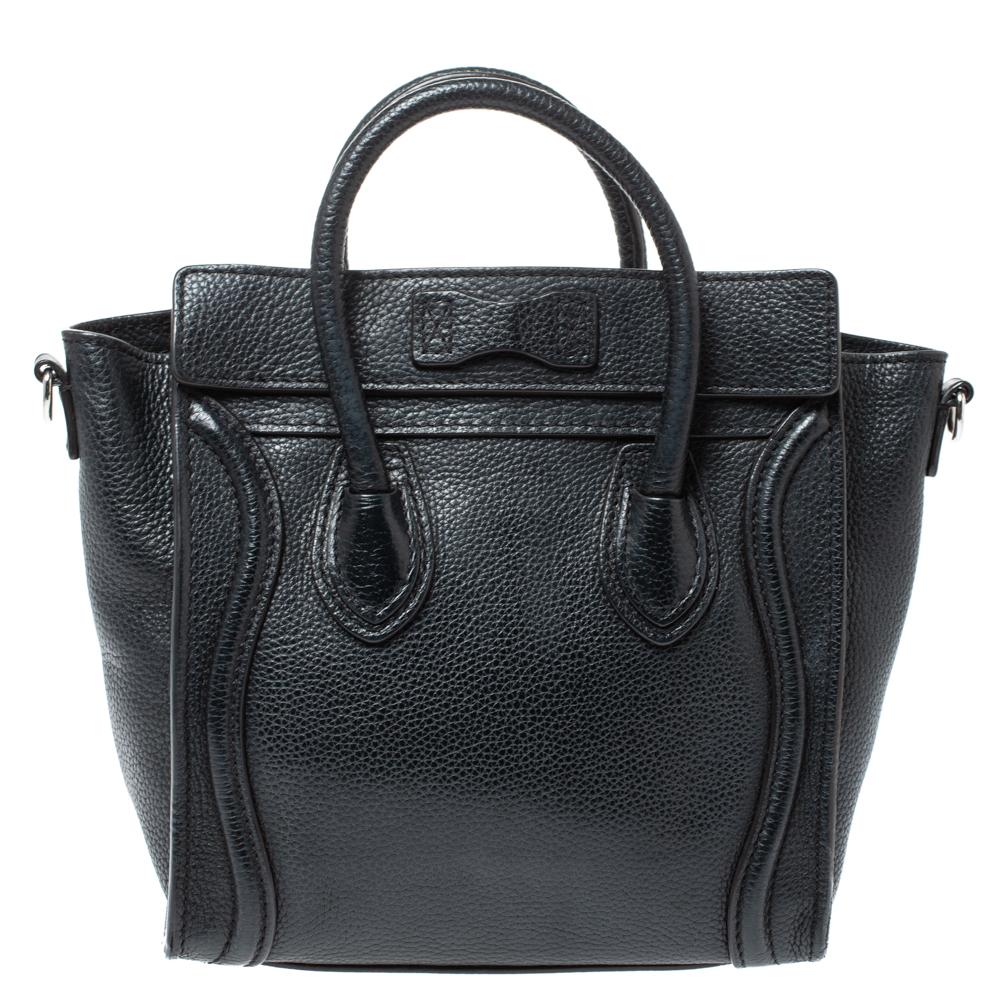 The Nano Luggage tote from Celine is one of the most popular handbags in the world. This tote is crafted from leather and designed in a black shade. It comes with rolled top handles, a detachable shoulder strap, and a front zip pocket. The bag is