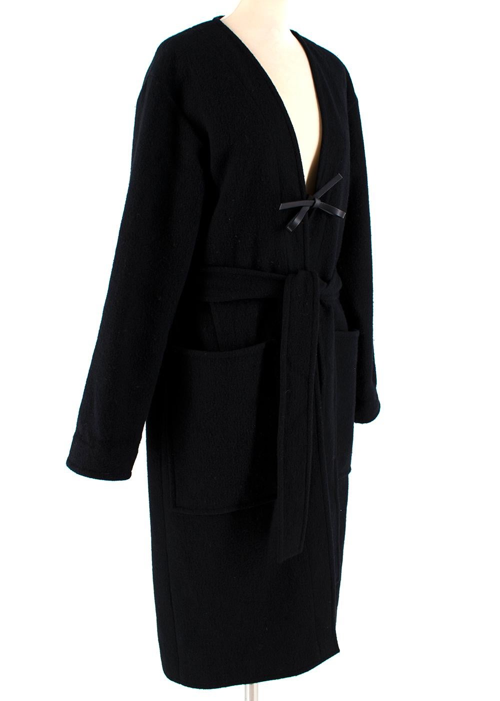 Celine Black and Navy Wool Coat
Wrap style with navy and black tie up belt
Leather interior belt
Side pockets
100% wool 
Measurements are taken laying flat, seam to seam. 
52cm shoulders
63cm sleeve
115cm length