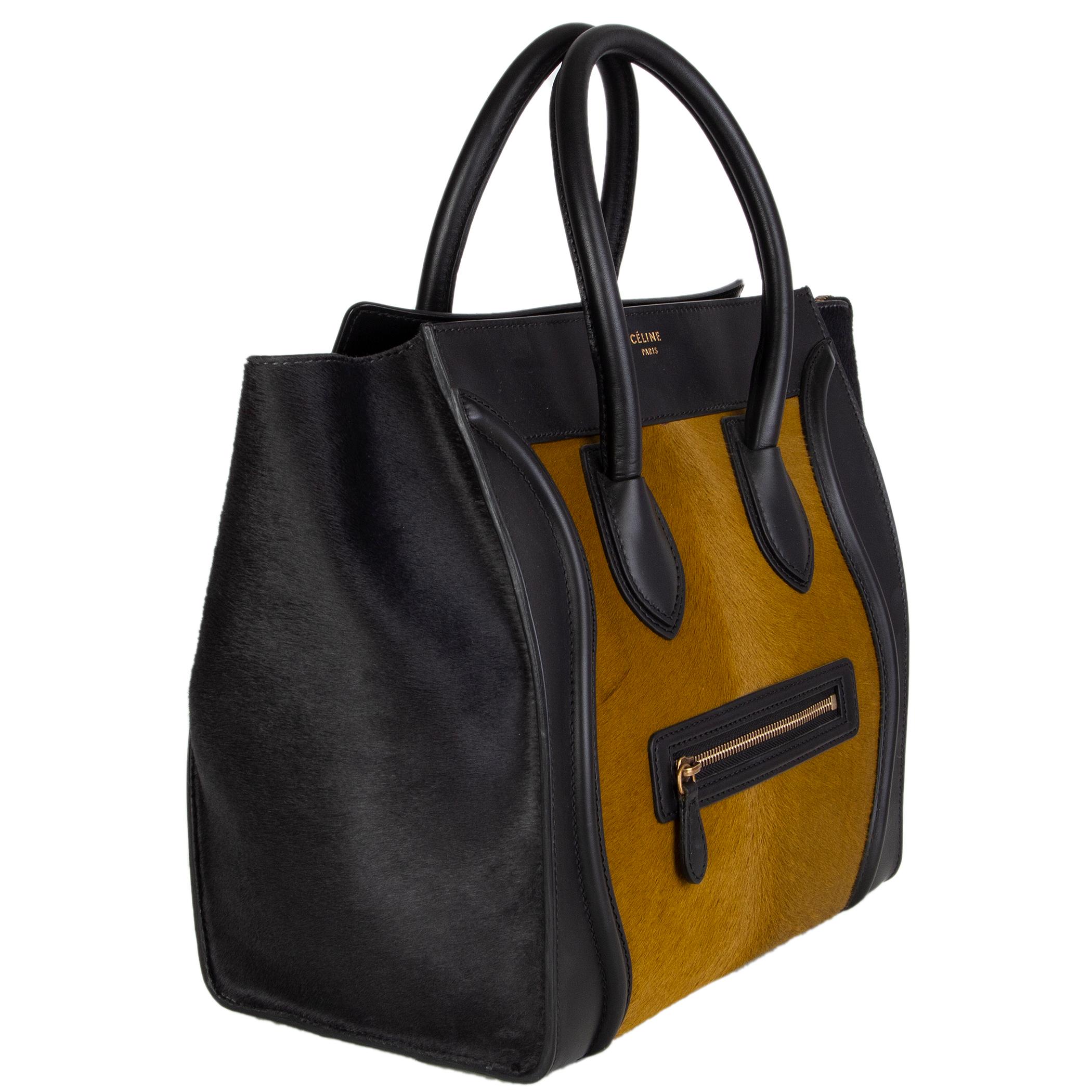 Céline 'Mini Luaggabe' tote in olive calf hair with black calf hair gussets and black leather details. Zipper pocket on the front. Closes with a zipper on top. Lined in black leather with two open pockets against front and a zipper pocket against