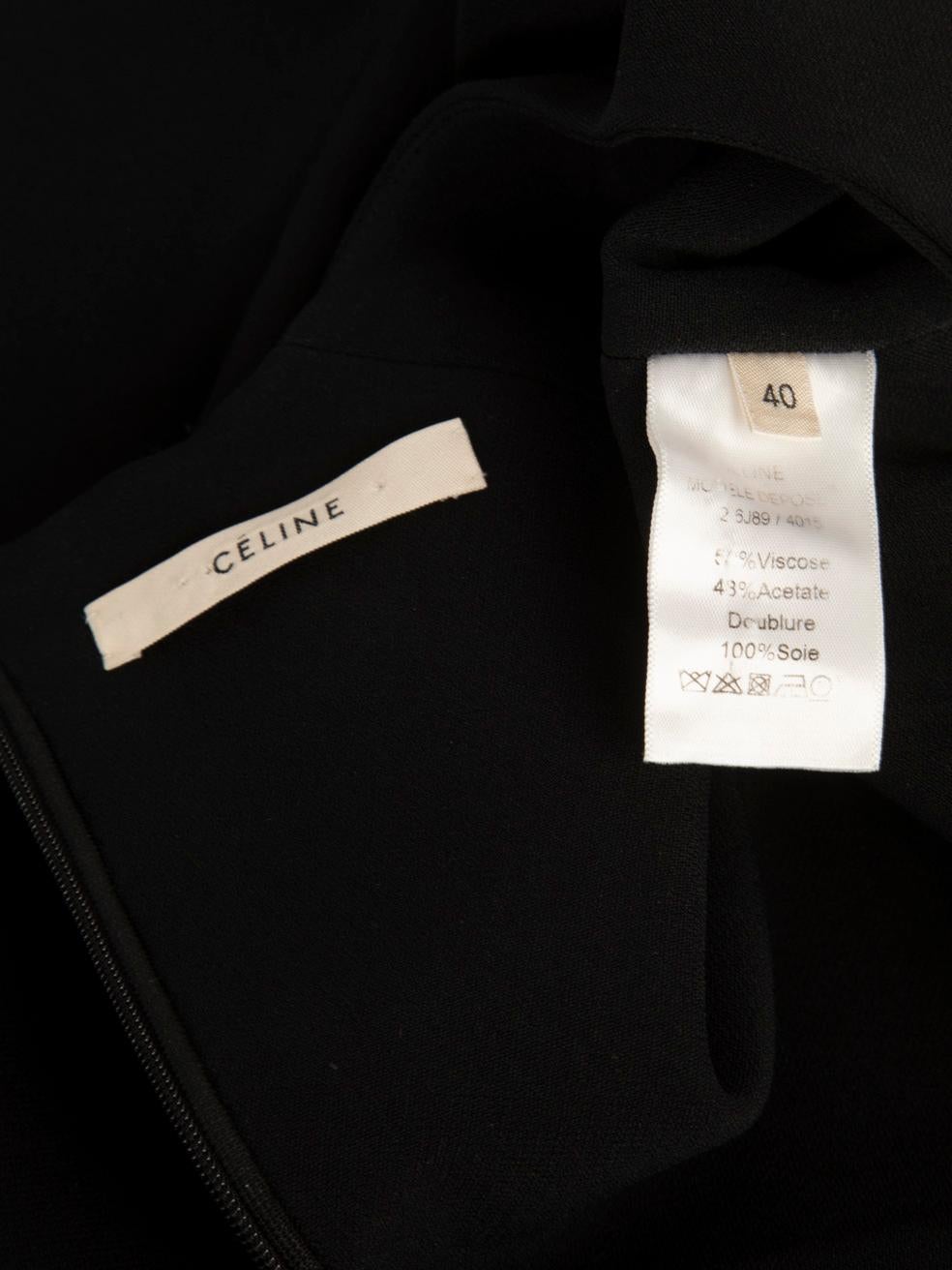Mini robe à péplum noire Céline Taille L en vente 4