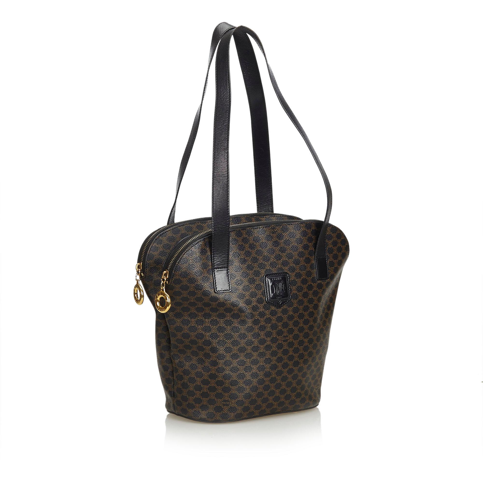 This tote bag features a PVC body, flat leather straps, double top zip closures, and an interior zip and slip pockets. It carries as B+ condition rating.

Inclusions: 
This item does not come with inclusions.

Dimensions:
Length: 28.00 cm
Width: