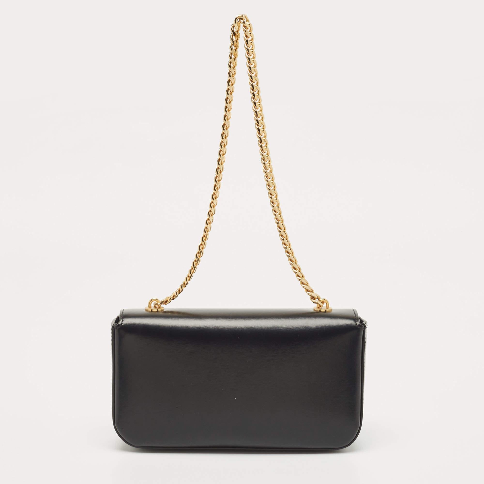 Marked by flawless craftsmanship and enduring appeal, this Celine Triomphe shoulder bag in black is bound to be a versatile and durable accessory. It has a compact size.

Includes: Original Dustbag, Original Box, Info Booklet


