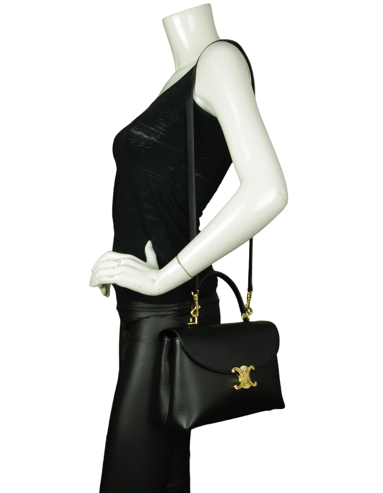 Celine Black Supple Calfskin Leather Medium Nino Top Handle Bag with Adjustable Strap

Made In: Italy
Year of Production: 2024
Color: Black 
Hardware: Goldtone
Materials: Supple calfskin leather 
Lining: Lambskin leather
Closure/Opening: Flap top