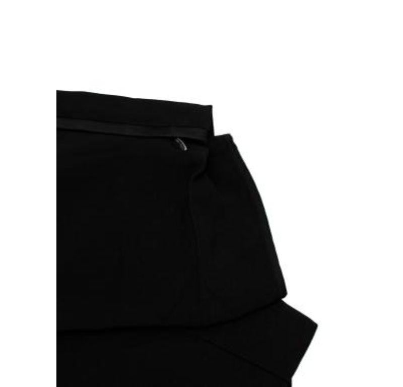 Celine Black Tapered Pants

- lightweight and slim fitting
- tapered leg
- 2 front pockets.
- 2 stitched back pockets.

Made in France.
Do not wash.
Condition 9.5/10.

PLEASE NOTE, THESE ITEMS ARE PRE-OWNED AND MAY SHOW SIGNS OF BEING STORED EVEN