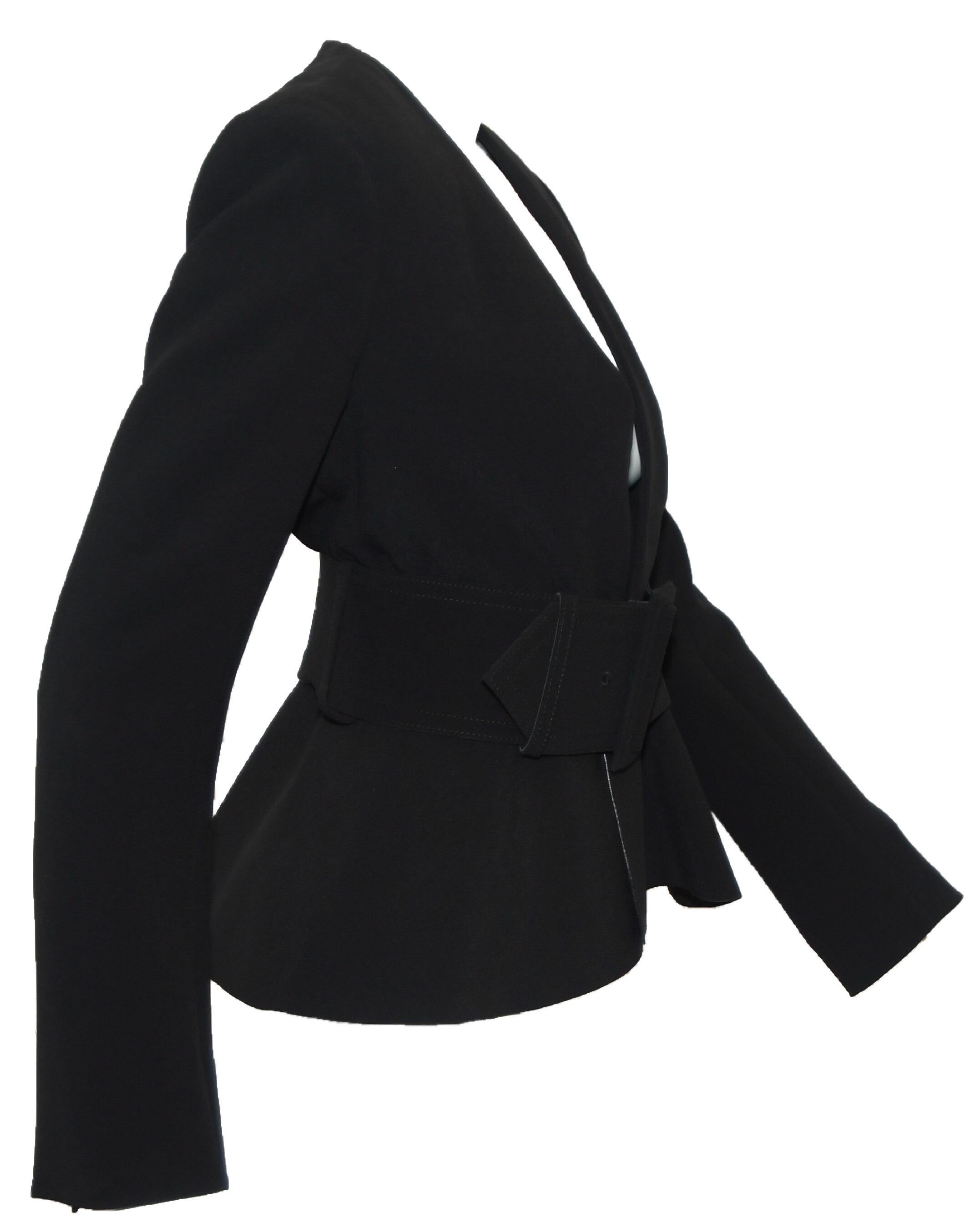 Celine's celebrated classic, minimalist and clean lines have made Pheobe Philo a household name.  Staying true to her initial ideology of polished pieces, this belted, peplum jacket incorporates a 3.50