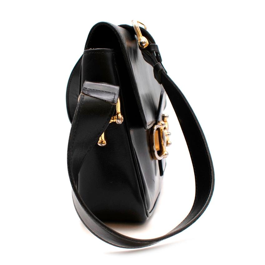 Celine Black Vintage Box Leather Horsebit Shoulder Bag

- Made of smooth polished box leather 
- Gorgeous horse-bit detail to the front 
- Gold tone hardware 
- Classic flap style 
- Adjustable shoulder strap 
- 2 small interior pockets
- 1 zipped