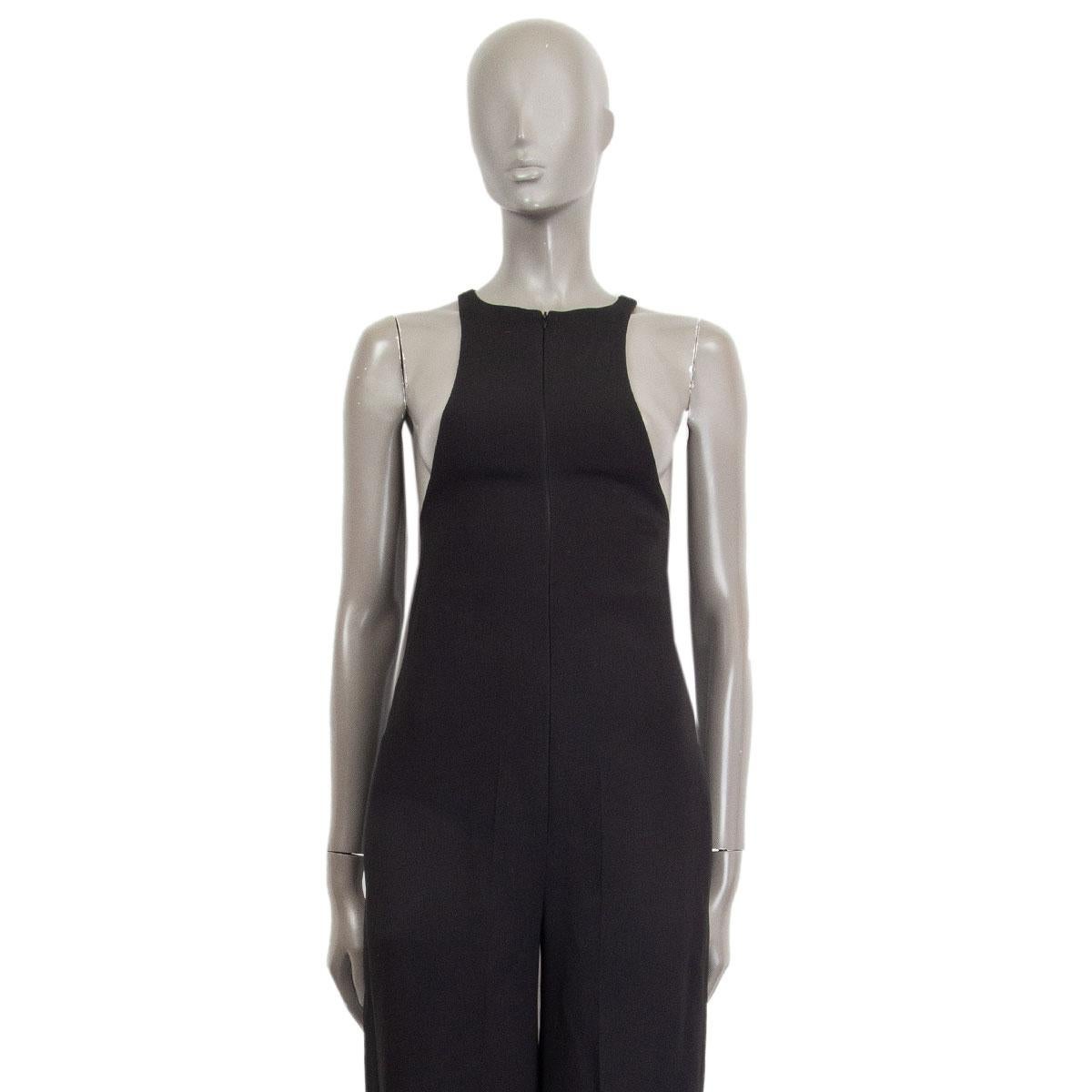 100% authentic Celine sleeveless, racer style top-part, jumpsuit in black viscose (65%), acetate (32%) and elastane (3%). Closes with a concealed zipper on the front and with slit pockets on the side. Lined in black silk (100%). Brand New with tag