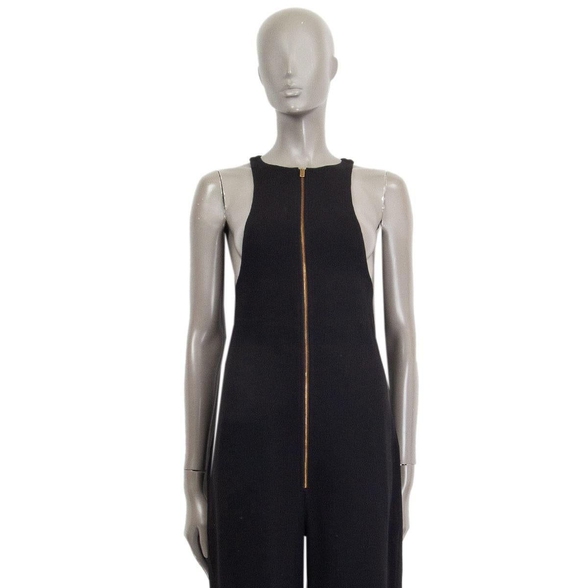100% authentic Celine sleeveless racer style top-part, zipped jumpsuit in black viscose blend (missing content tag). Closes with a gold-tone zipper on the front and with slit pockets on the side. Unlined. Has been worn and is in excellent