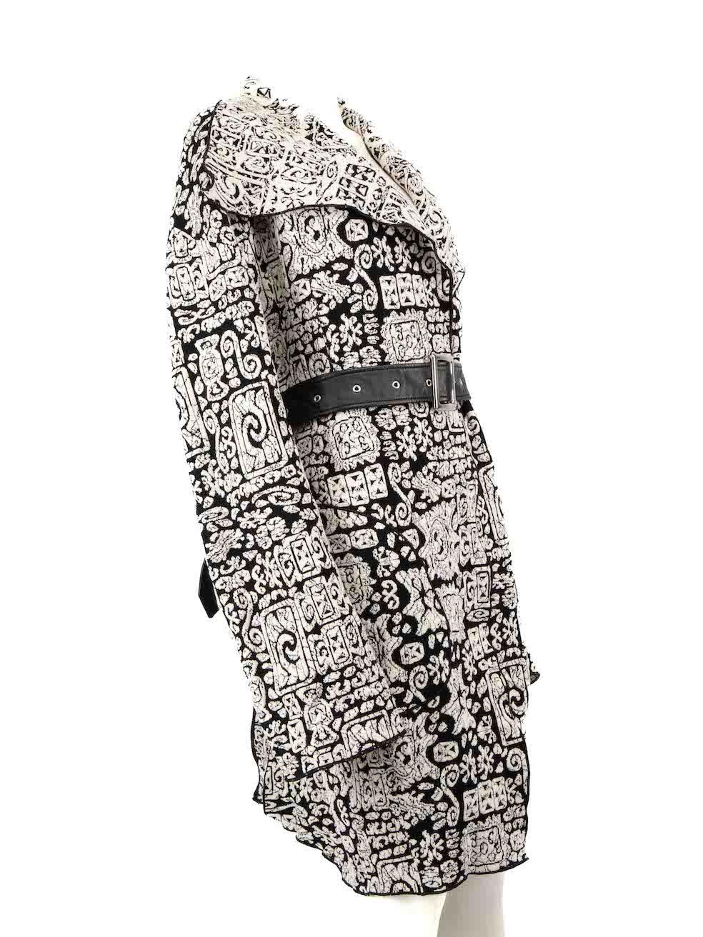 CONDITION is Very good. Minimal wear to coat is evident. Minimal scratches to buckle hardware on belt. The belt hoop on the left has been unstitched on this used Céline designer resale item.
 
 
 
 Details
 
 
 Black and white
 
 Cotton
 
 Coat
 
