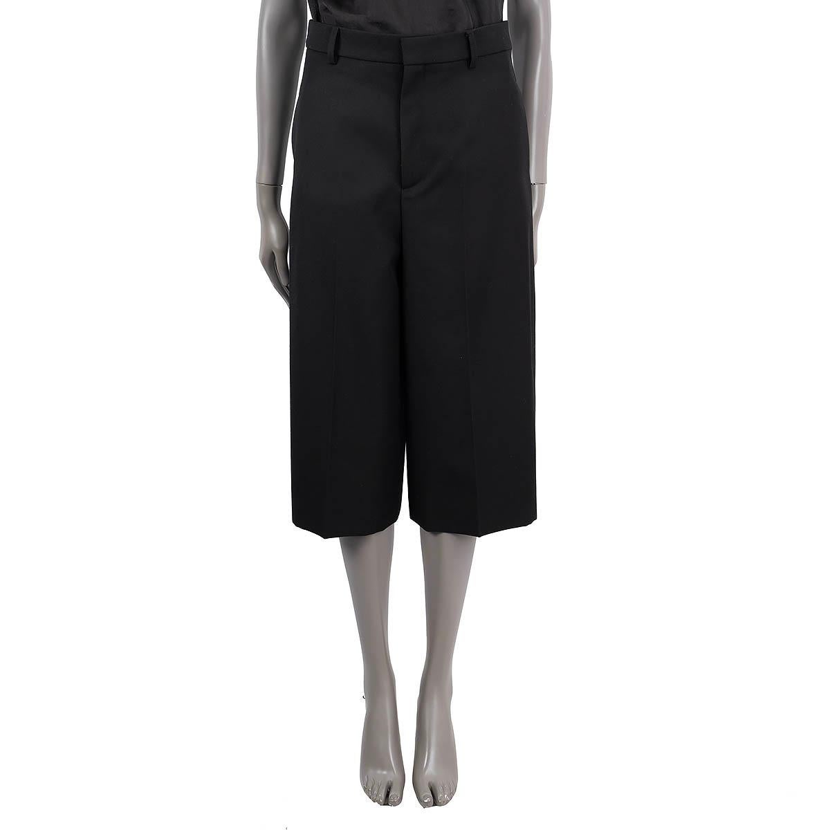100% authentic Celine culotte pants in black polyester (55%) and wool (45%). Feature wide legs, two slit pocket on the sides, two buttoned pockets on the back and belt loops. Unlined. Have been worn and are in excellent condition.

2020