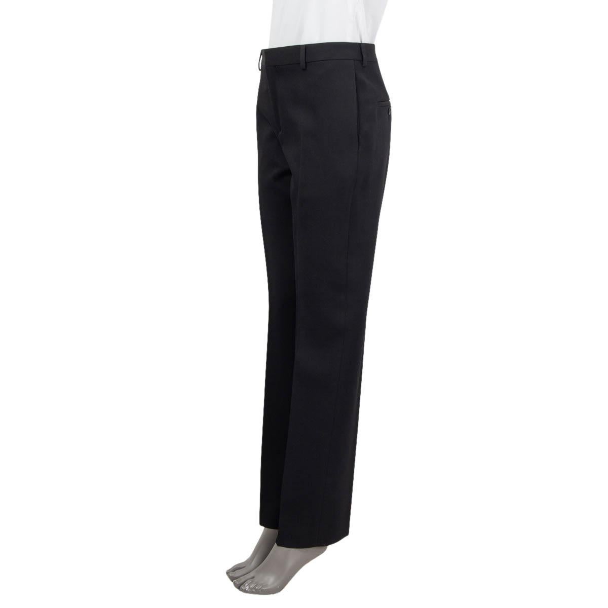 100% authentic Celine straight leg pleated pants in black wool (100%). Feature two side slit pockets, belt loops and two buttoned, sewn shut slit pockets at the back. Open with a concealed hook, button and zipper on the front. Pockets lined in black