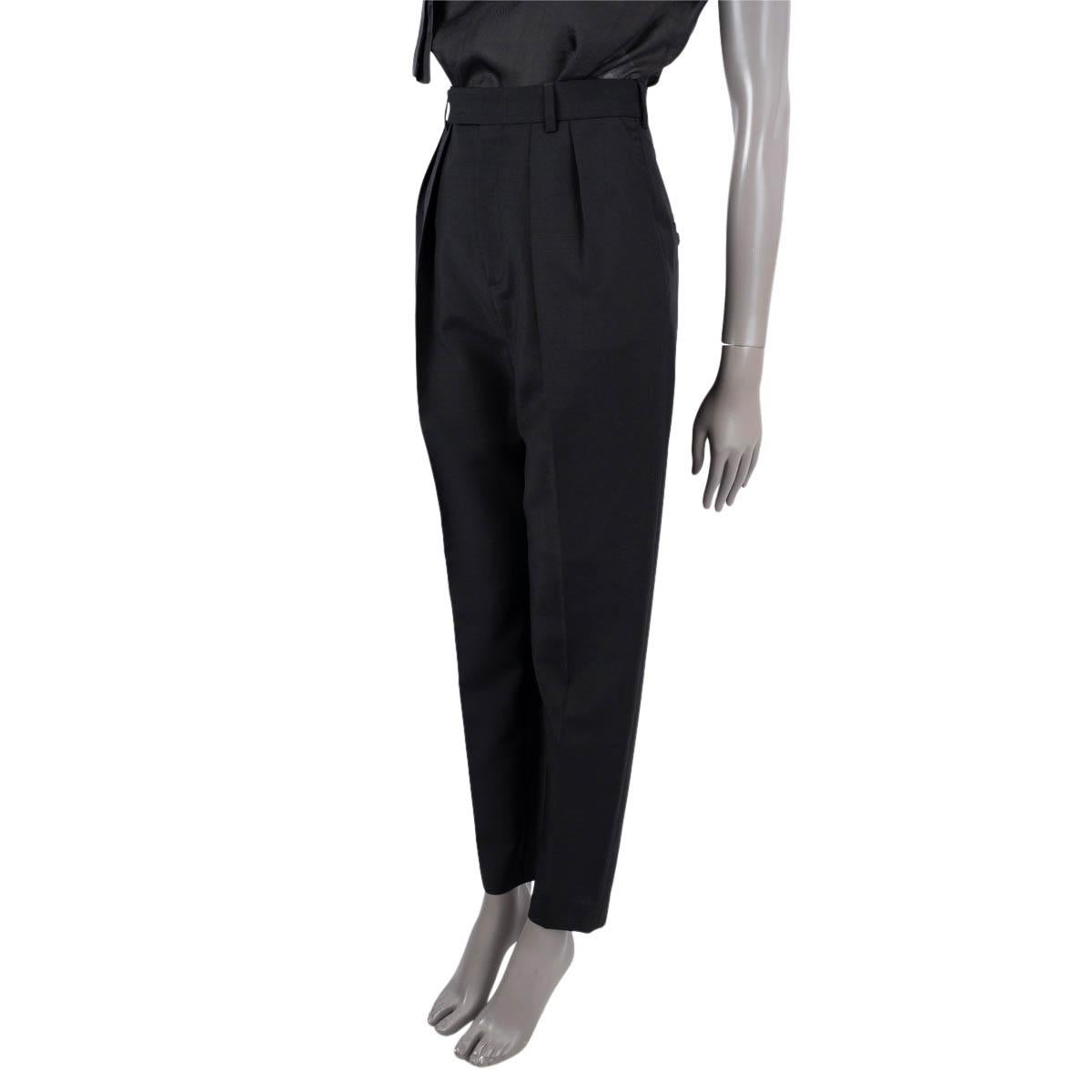 100% authentic Celine double pleated  suit pants in black wool (75%) and mohair (25%). Features belt loops two side and back pockets. Close on the front with with a concealed zipper, button and hook fastener. Unlined. Have been worn and are in