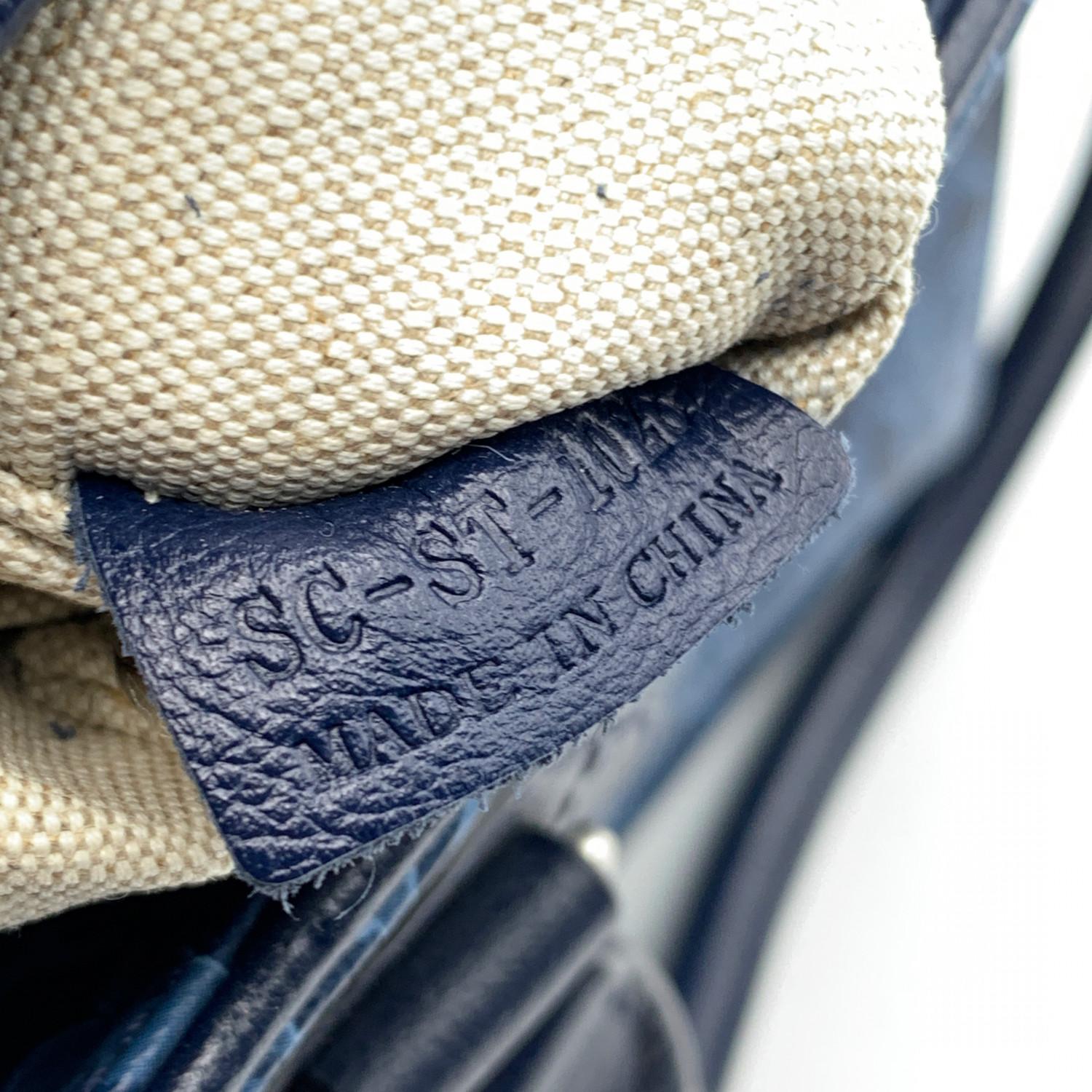 Celine blue Carriage print tote bag. Crafted in printed canvas with blue genuine leather trim and handles. Silver metal hardware. Upper zipper closure. Beige fabric lining. 3 side open pockets and D-ring inside. 'Celine' tag inside (with serial