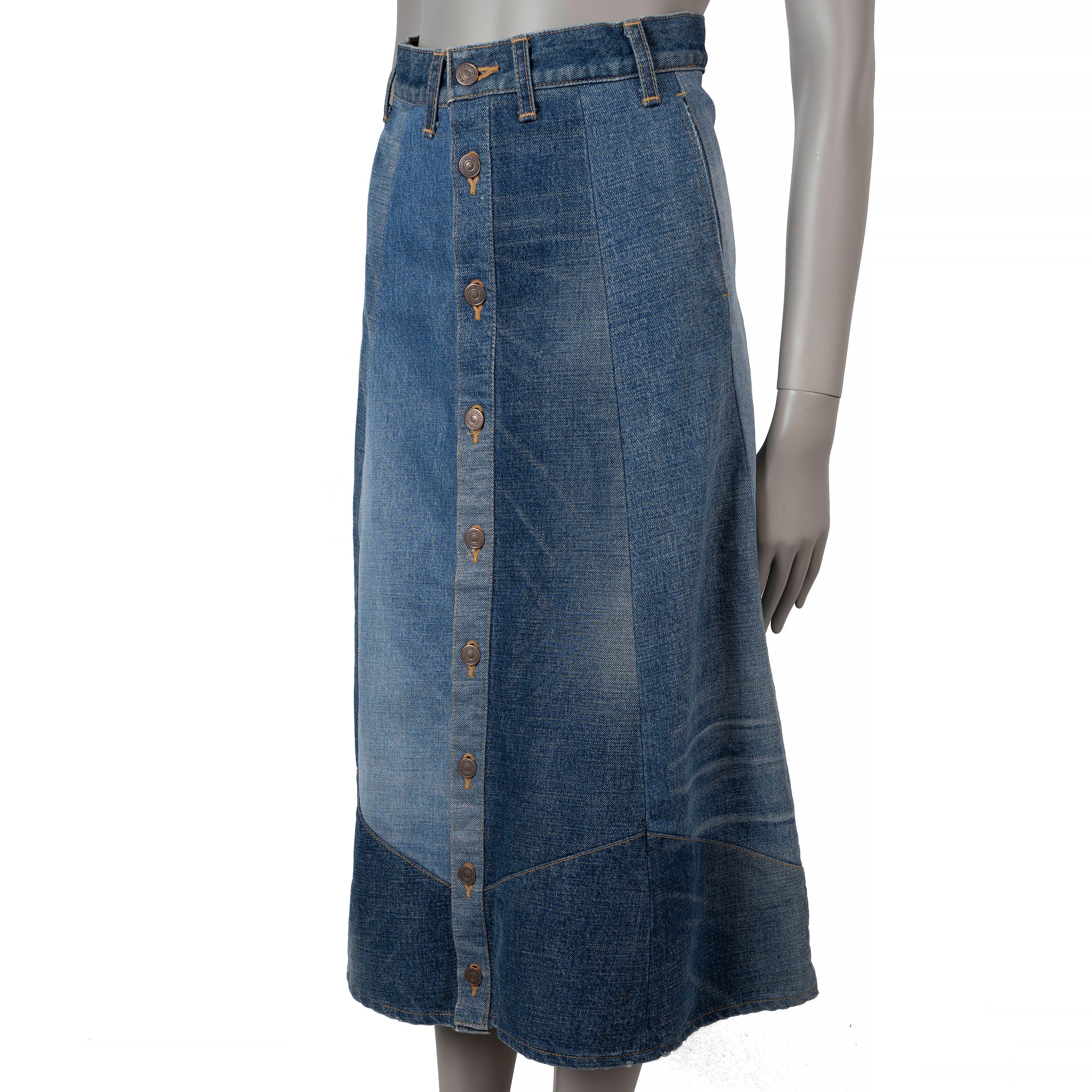 This 100% authentic Celine patchwork midi skirt is crafted from blue multicolor wash denim cotton (100%). It features an A-line silhouette, a high-waist, and welt pockets for a chic yet casual look. The skirt closes with logo-engraved copper buttons