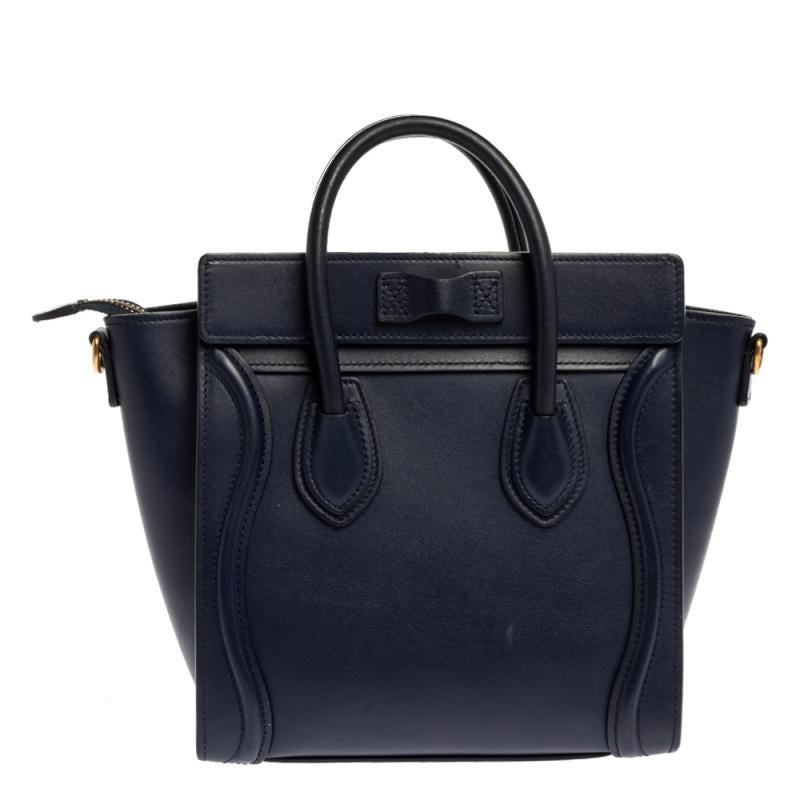 The Nano Luggage tote from Celine is one of the most popular handbags in the world. This tote is crafted from leather and designed in a blue shade. It comes with rolled top handles, a detachable shoulder strap and a front zip pocket. The bag is