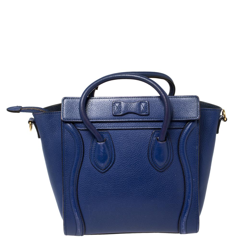The Luggage tote from Celine is one of the most popular handbags in the world because of its style and practicality. This tote is crafted from leather and designed in a blue shade. It comes with rolled top handles, a detachable shoulder strap, and a
