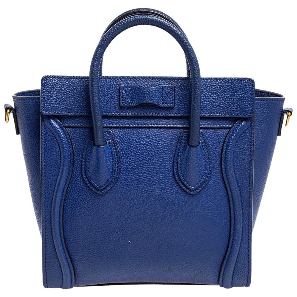 The Luggage tote from Celine is one of the most popular handbags in the world. This tote is crafted from leather and designed in a blue shade. It comes with rolled top handles, a detachable shoulder strap, and a front zip pocket. The bag is equipped