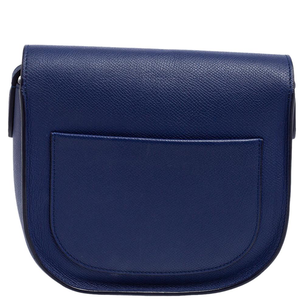 This crossbody bag from Celine is adorable! The blue bag is crafted from leather and features a compact silhouette. It flaunts a front tuck-in flap closure that opens to a leather-lined spacious interior capable enough of carrying your daily