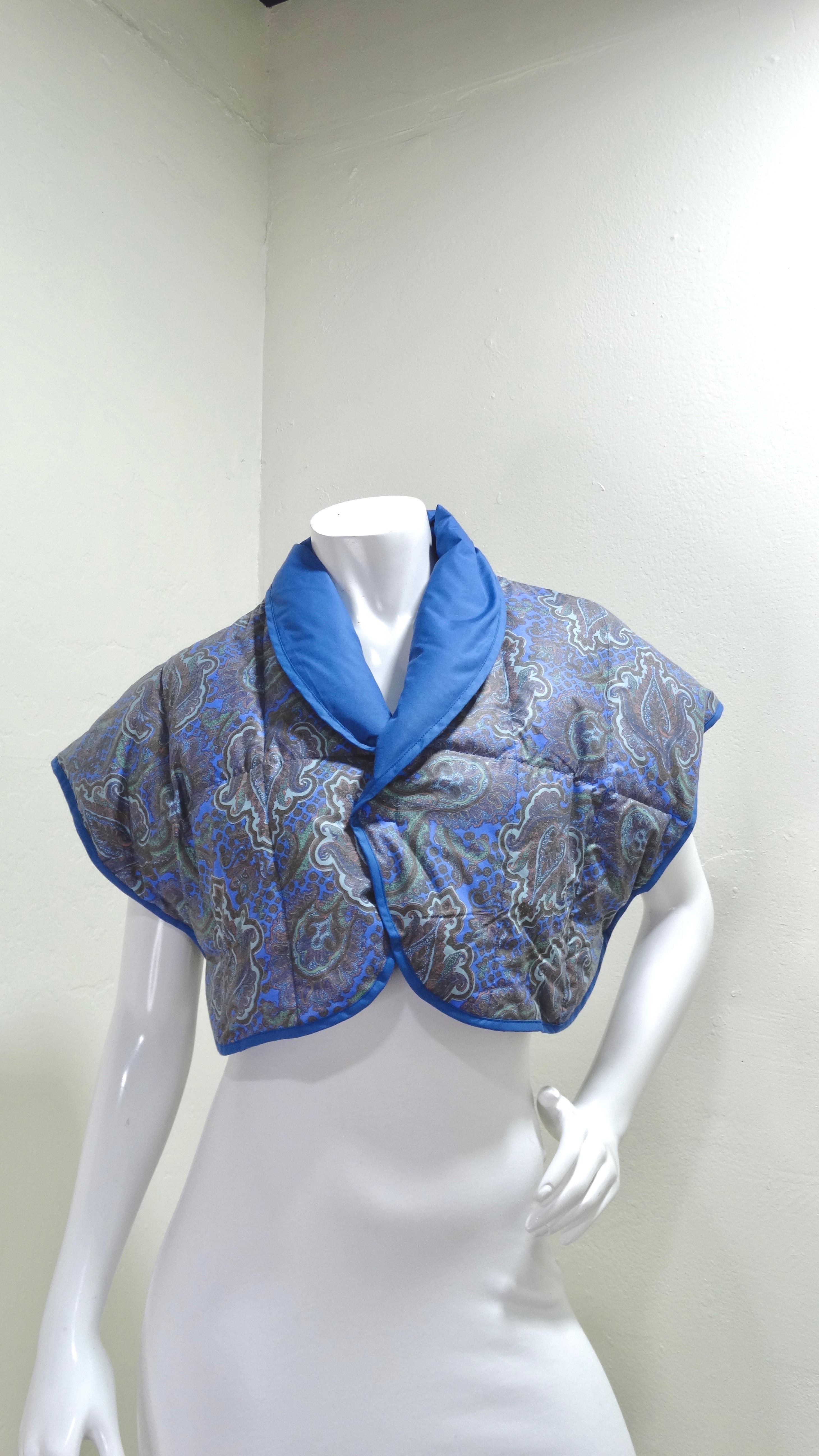 You won't want to miss out on this incredibly rare find! There's no way you won't feel like the most fashionable in the room in this bolero. This is a padded and quilted CELINE bolero that is featured in a blue, green, and orange paisley print.