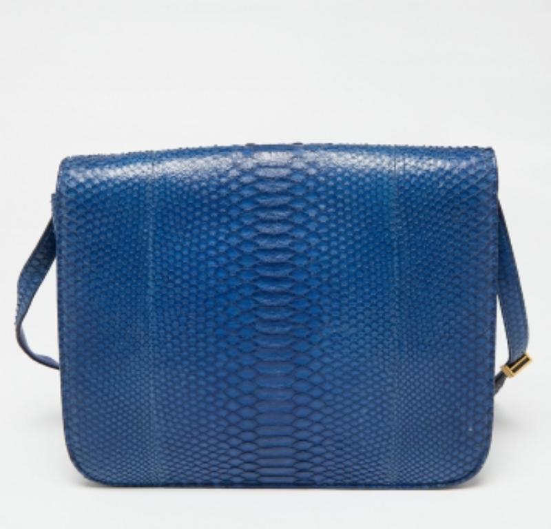 With an architectural shape, this Celine bag has the amalgamation of classic allure and faultless craftsmanship. It is made from python skin and will be a valuable addition to your closet. Lined with leather, it will safely house your essentials and