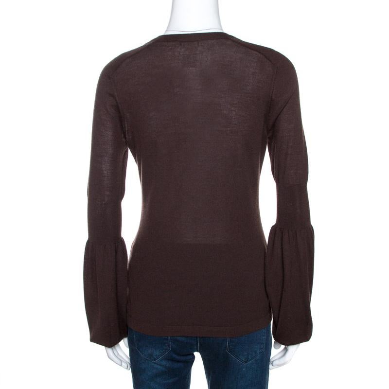 This is a classic top from Celine that has been made from cashmere. This sweet brown top exhibits a well-balanced combination of comfort and fashion in its design. It has long sleeves, a V neckline and a great fit.

