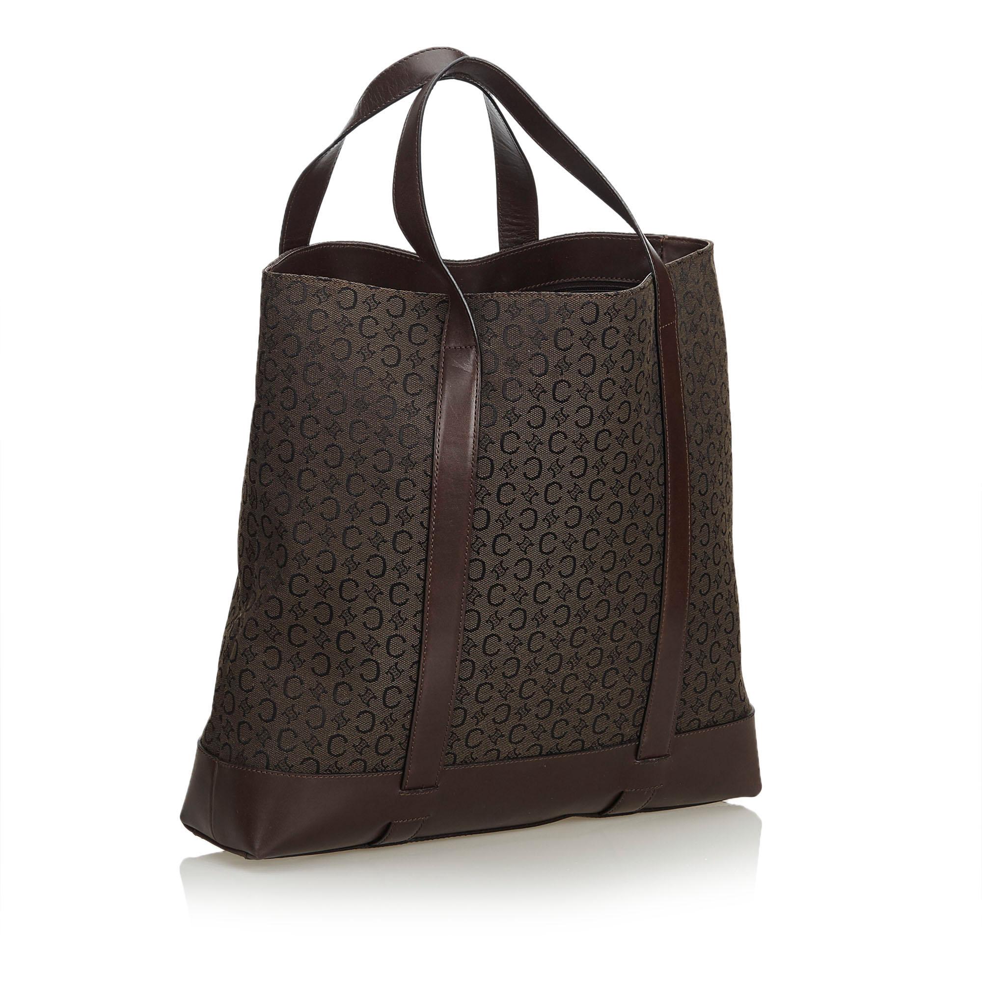 This tote bag features a jacquard body, flat leather straps, an open top, interior zip and slip pockets. It carries as B+ condition rating.

Inclusions: 
Dust Bag

Dimensions:
Length: 26.00 cm
Width: 41.00 cm
Depth: 10.00 cm
Hand Drop: 14.00