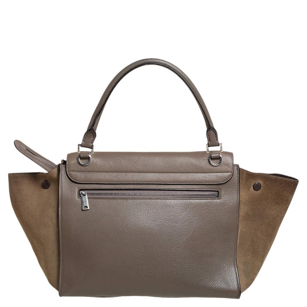 In every stride, swing, and twirl, this beautiful Celine bag will stand out. Crafted from leather and suede in Italy, the bag has a style that will catch glances from a mile. It has been designed with signature flappy wings and a flap that reveals a