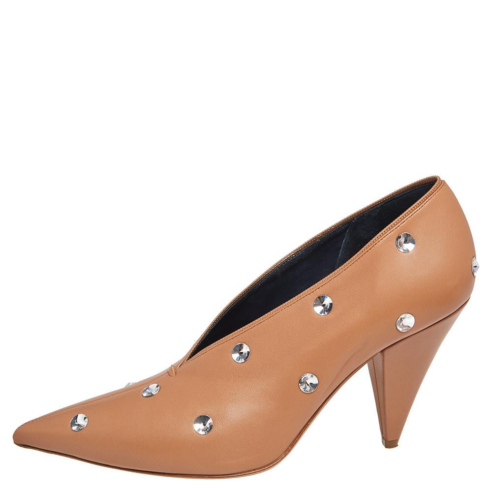 You are sure to fall head over heels in love with this pair of V Neck pumps from Celine. These stylish pumps will add a touch of elegance to any outfit. Crafted in Italy, they are made from leather. They are styled with pointed toes, crystals,