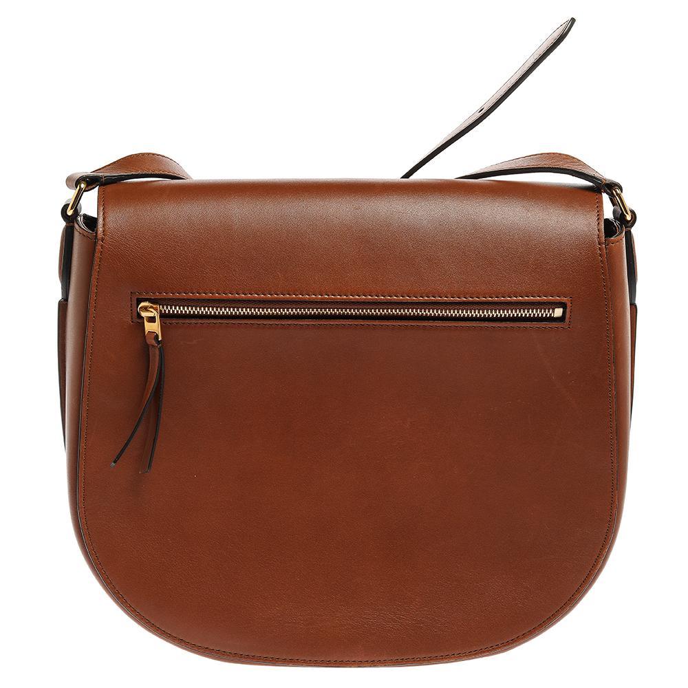 How cute and adorable is this bag from Celine! The brown bag is crafted from leather and features a compact silhouette. It flaunts a front tuck-in flap closure that opens to a leather-lined spacious interior capable enough of carrying your daily