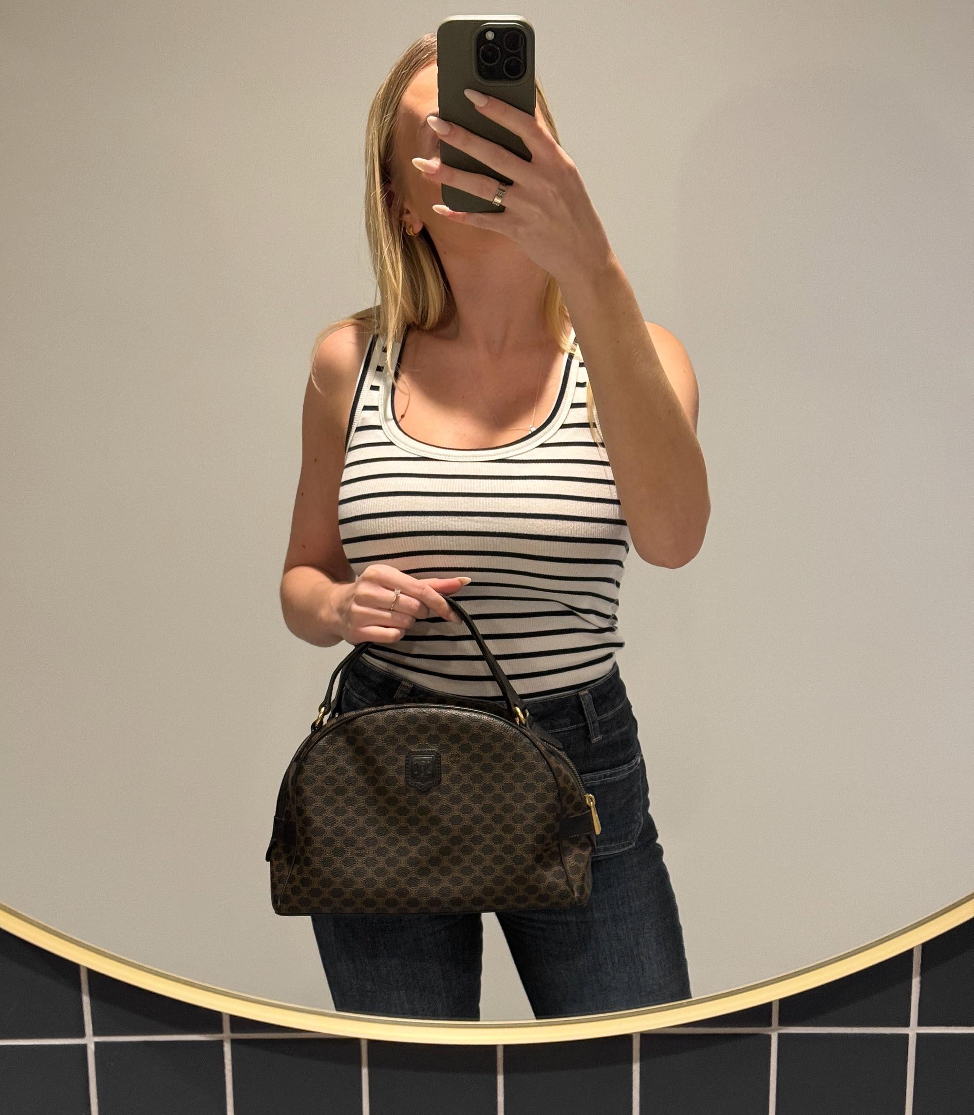 Celine Brown Macadam Monogram Coated Canvas & Black Calfskin Leather Vintage Bowling Bag

Product Details
Xupes Ref: HB5897
Brand: Celine
Model: Bowling Bag
Type: Top Handle, Shoulder
Serial Number: MC98/1
Age: 1998
Colour: Brown, Black 
Hardware: