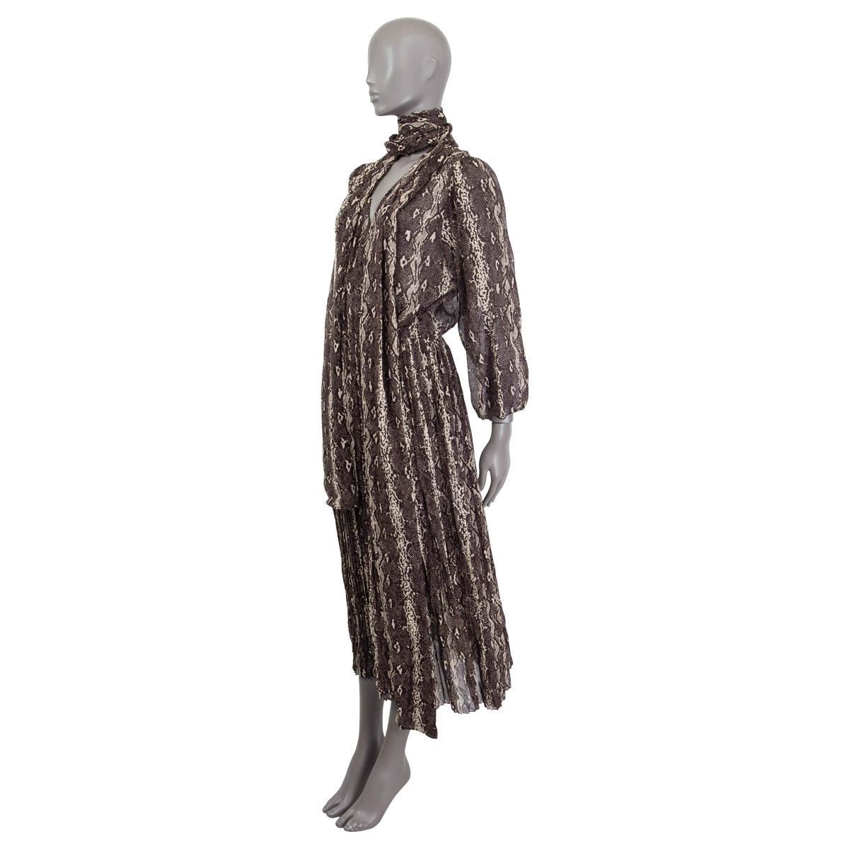 100% authentic Celine pleated fluid maxi dress in brown and ivory georgette silk ( assumed cause tag is missing). Features a snake print, long puffed sleeves and a deep v-neck. Has a detachable belt. Opens with a concealed zipper on the side.