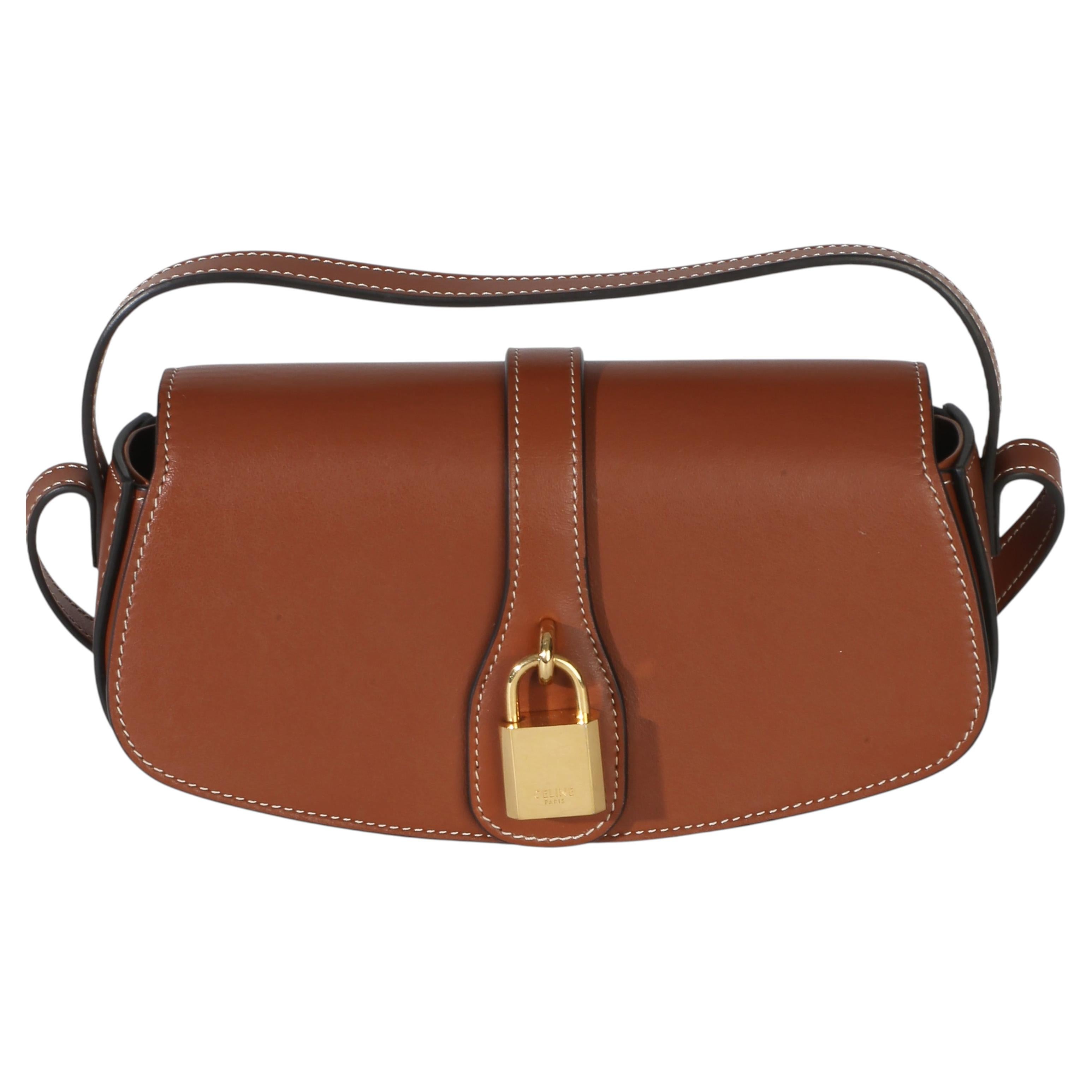 Pochette Tabou in vitello liscio marrone di Celine con tracolla