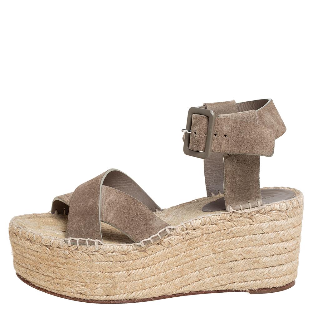 These stunning sandals by Celine are made for a fashionista like you! Crafted from suede in a pretty brown hue, they feature buckle fastening, crossover straps to the front, and 8 cm wedge heels. Wear them with a midi dress to exude a chic