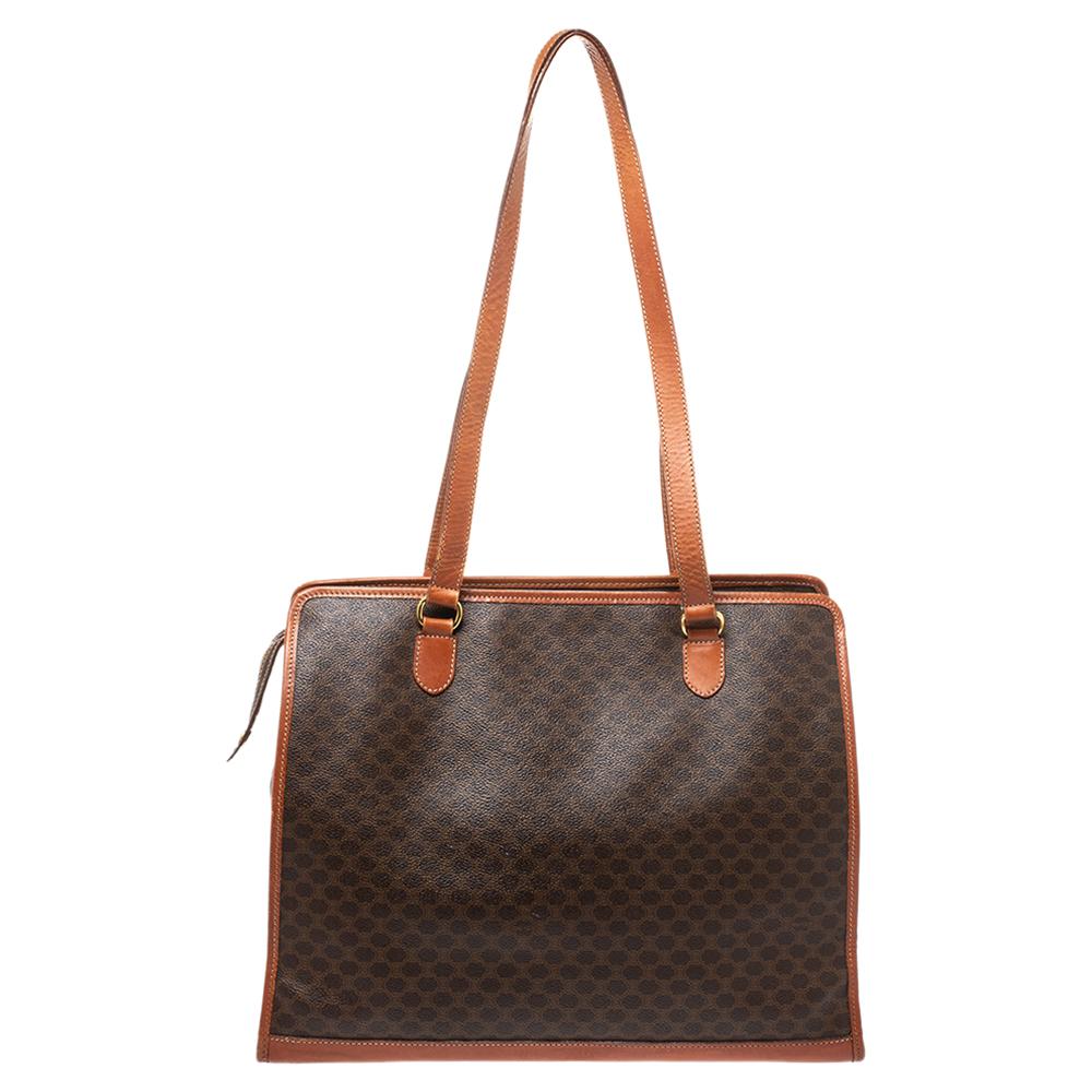 Make an exquisite appearance every time you carry this ageless Macadam tote bag by Celine. This brown & tan piece will reflect your stylish personality and add verve to it. Give your work wardrobe an instant elegant boost with this chic coated