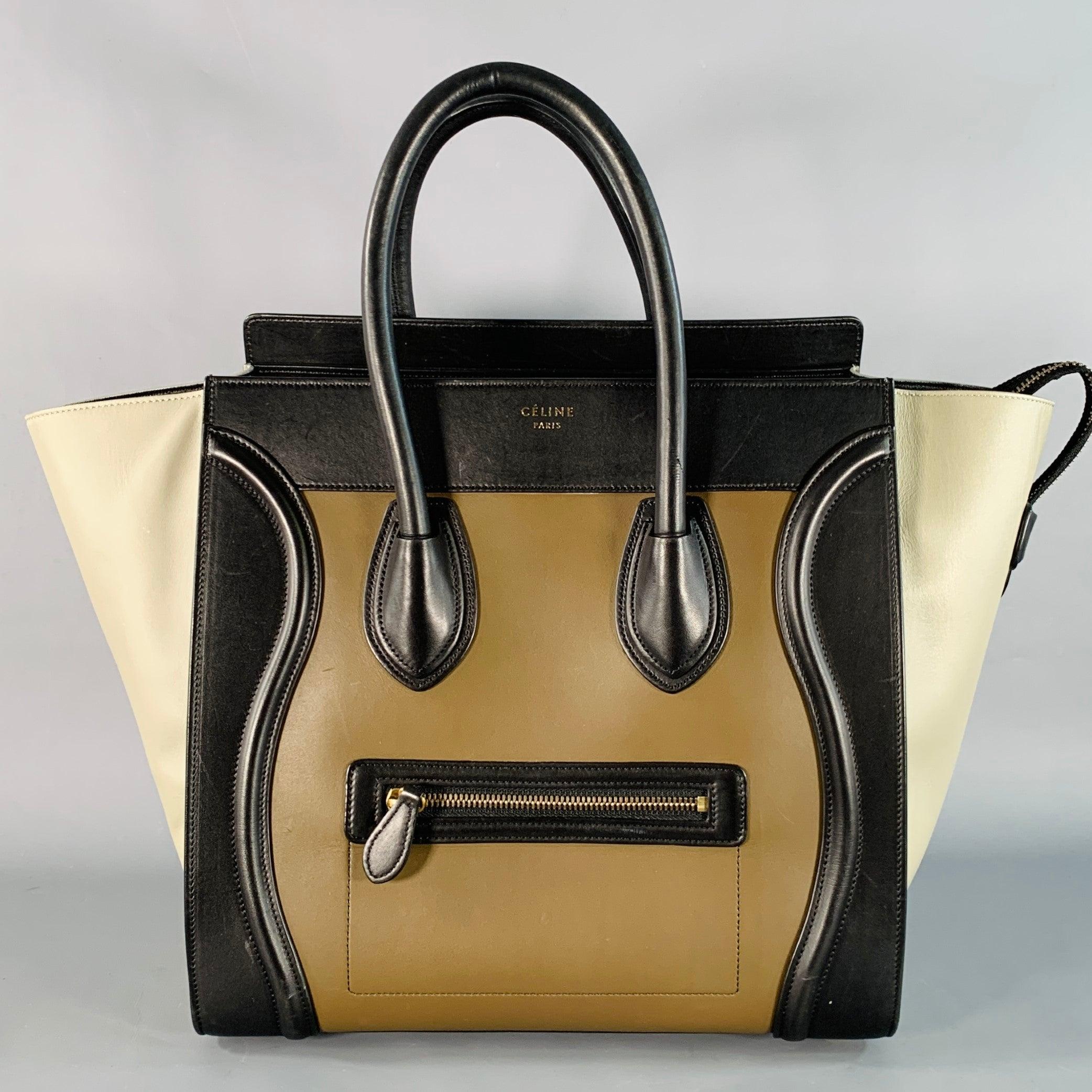 CELINE tote
in a brown and taupe leather featuring rolled leather top handles, small front zip pocket, and zip top closure.Very Good Pre-Owned Condition. Minor signs of wear. 

Measurements: 
  Length: 11.75 inches Width: 5.5 inches Height: 11.5
