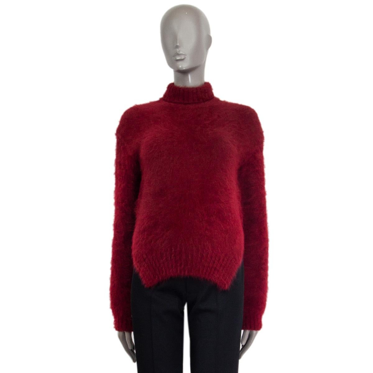100% authentic Celine turtleneck sweater in burgundy angora (77%) polyamide (23%) with two side-slits. Comes with a ribbed turtleneck, hem, and ribbed cuffs. Slip-on sweater. Has been worn and is in excellent condition.

Measurements
Tag