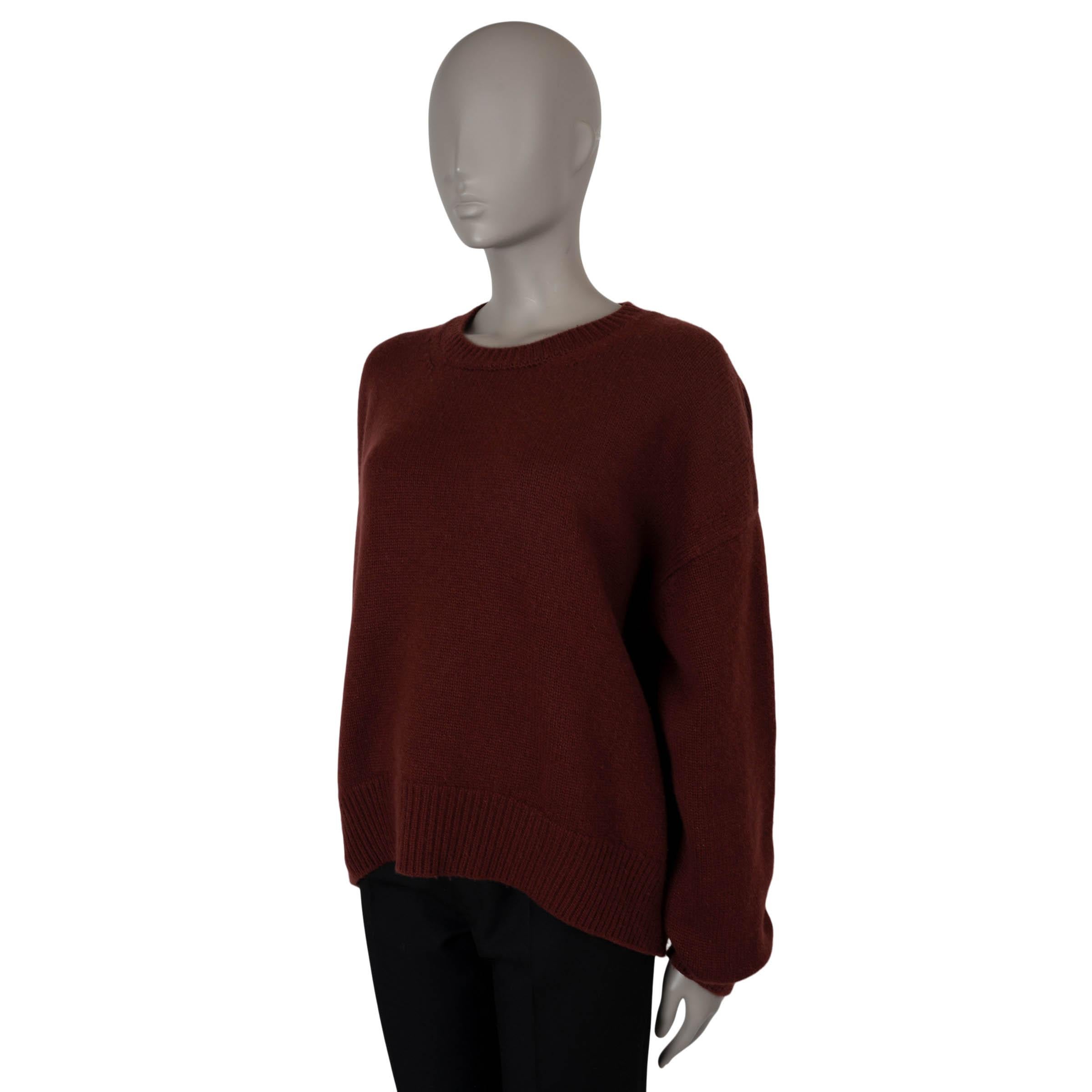This 100% authentic Céline by Phoebe Philo sweater is crafted from a luxurious blend of burgundy technical lux cashmere (88%) and polyester (12%). It features an oversized, boxy fit with dropped shoulders for a relaxed silhouette, along with a