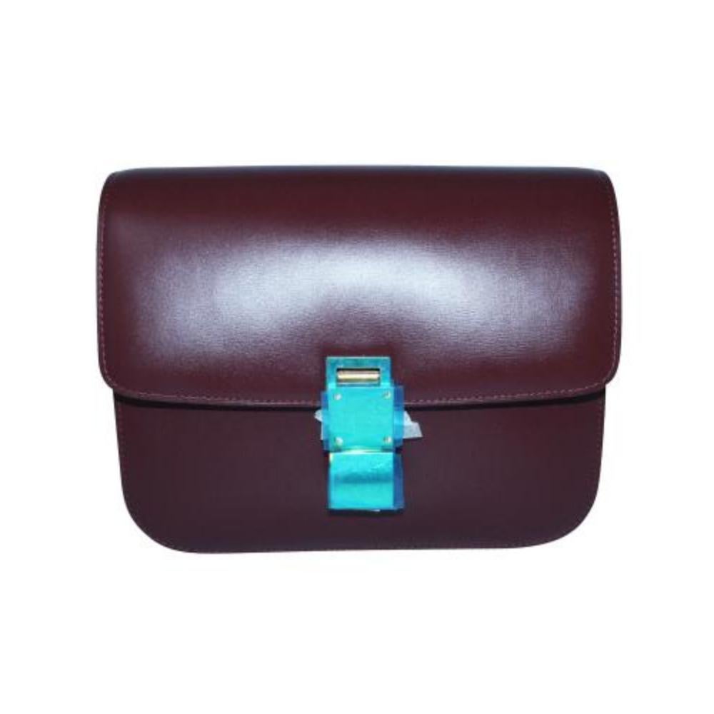 Celine Burgundy Medium Classic bag in box calfskin

Made in Italy, Two compartments, zipped pocket, golden hardware. Only one minimal ( almost not visible scratch at the top) - rest of the bag is in pristine condition, never been used. The plastic
