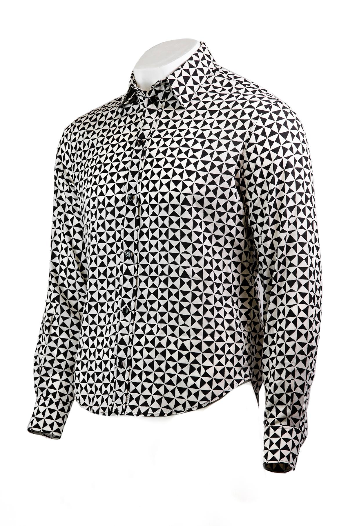 Celine by Heldi Slimane monochrome shirt.

This 70s inspired shirt is made from a soft viscose and features a relaxed fit, black and white triangle pattern, a collared neckline, long cuffed sleeves and a front button closure. So typically Hedi