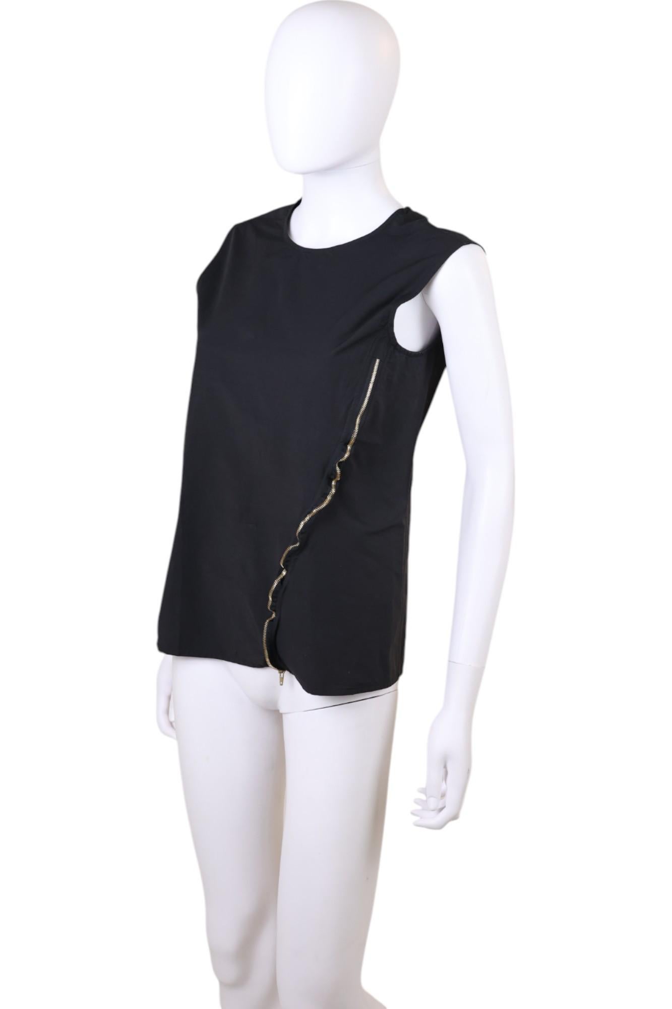 - Designed by Phoebe Philo
- 2010's Period
- Asymmetric Zipped Sleeveless Tank Top
- Asymmetrical gold-tone zipper running diagonally down the front
- Round crew neck
- Relaxed, loose-fitting silhouette
- High-quality gold-tone zipper with