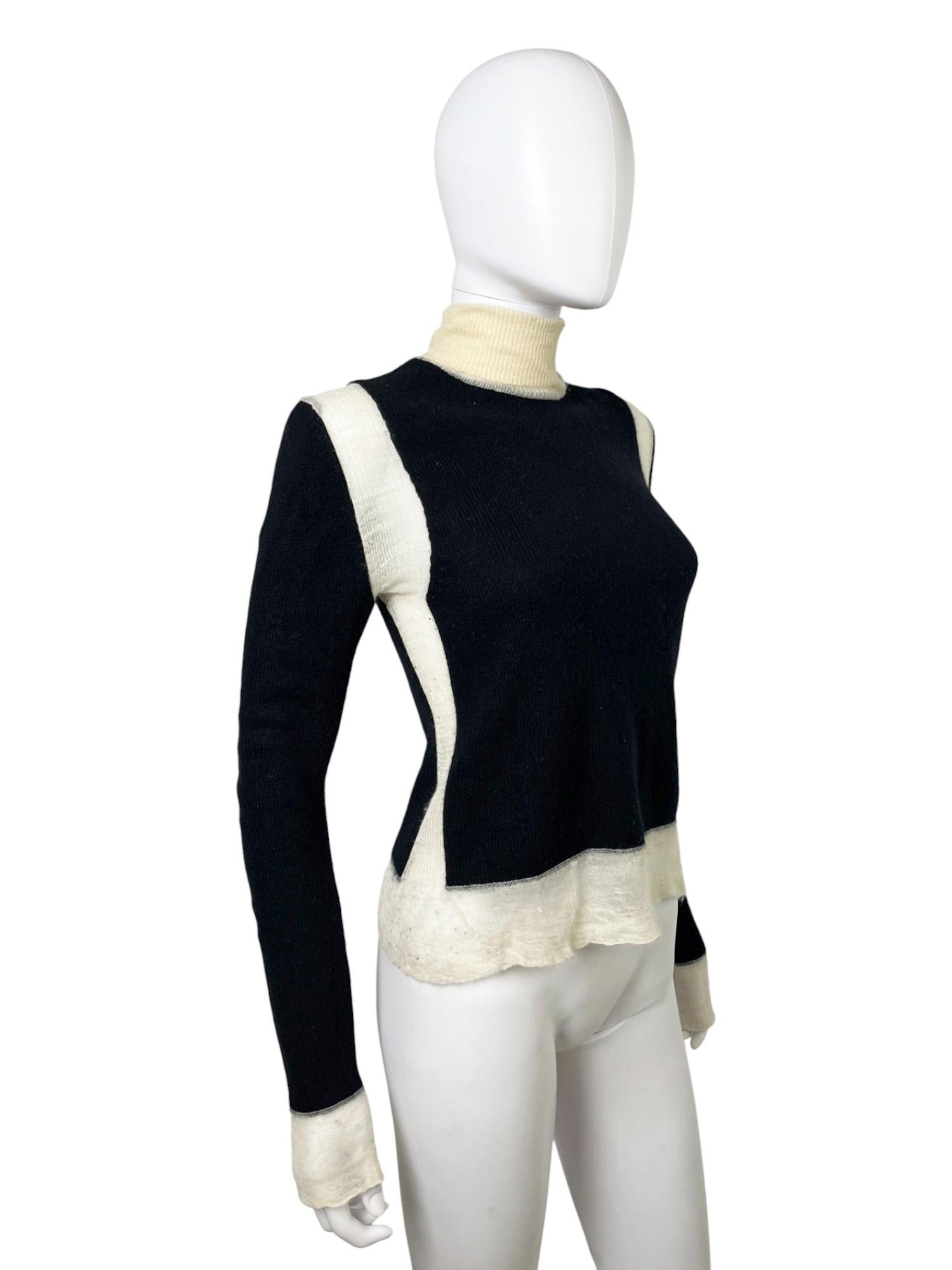 - Designed by Phoebe Philo
- 2010's period
- Double Layered Alpaca Black Turtleneck
- High neckline
- Semitransparent knitted parts at the hem, shoulders and wrists
- Very good condition: just some yellowing
- Made in China
- Materials: Cashmere and