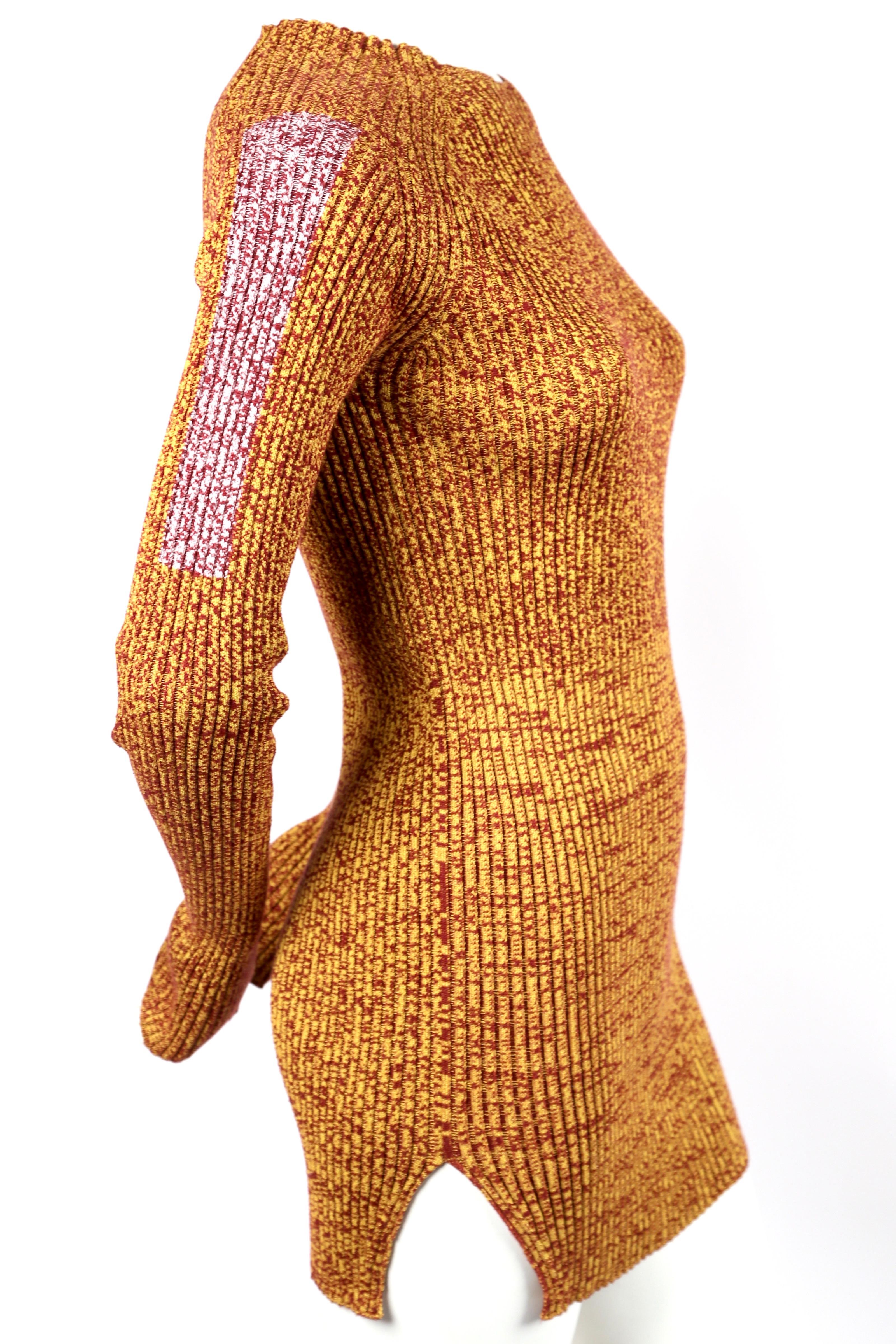 Yellow and red marled knit tunic with slits designed by Phoebe Philo for Celine dating to resort of 2015. Also, featured in the Celine 2015 spring ad campaign. French size XS. Approximate measurements (unstretched): bust 26