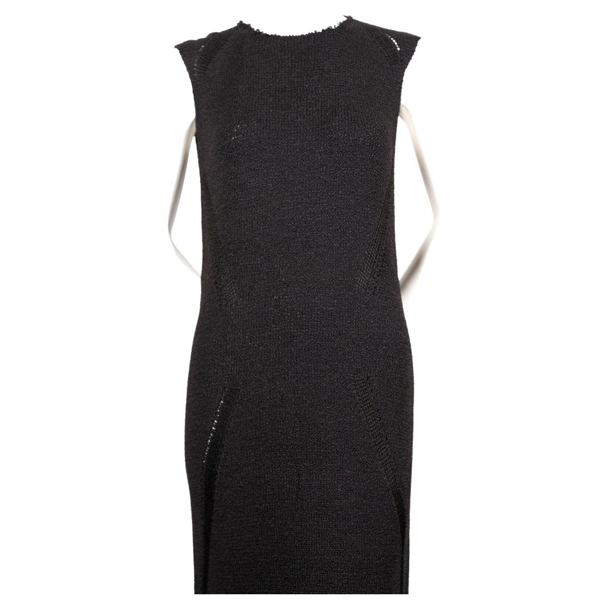 Jet-black, floor length knit dress with raw collar and delicate woven hem designed by Phoebe Philo for Celine. Size S. Approximate measurements: shoulder 13.5