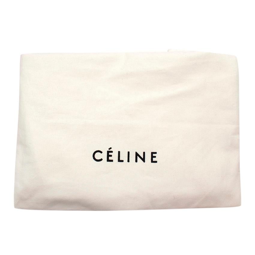 Celine by Phoebe Philo Black Leather Trapeze Bag

-Celine by Phoebe Philo
-Made of soft smooth leather 
-Single rounded top handle
-Adjustable detachable shoulder strap
-Foldover top
-Flip-lock fastening
-Top zip fastening
-Internal patch