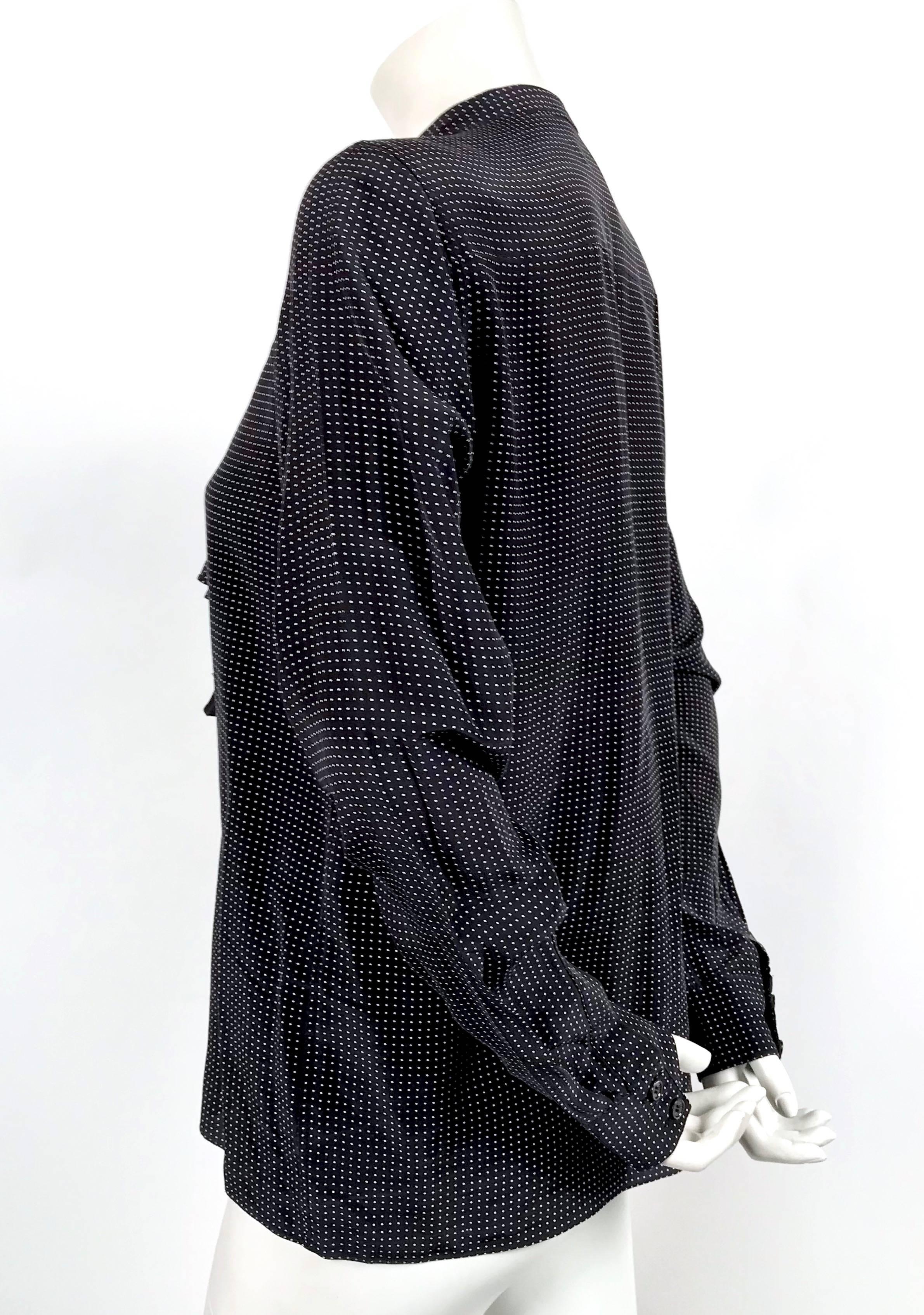 Soft black silk shirt with draped shoulder designed by Phoebe Philo for Celine dating to 2010. French size 38. Approximate measurements: shoulder 15