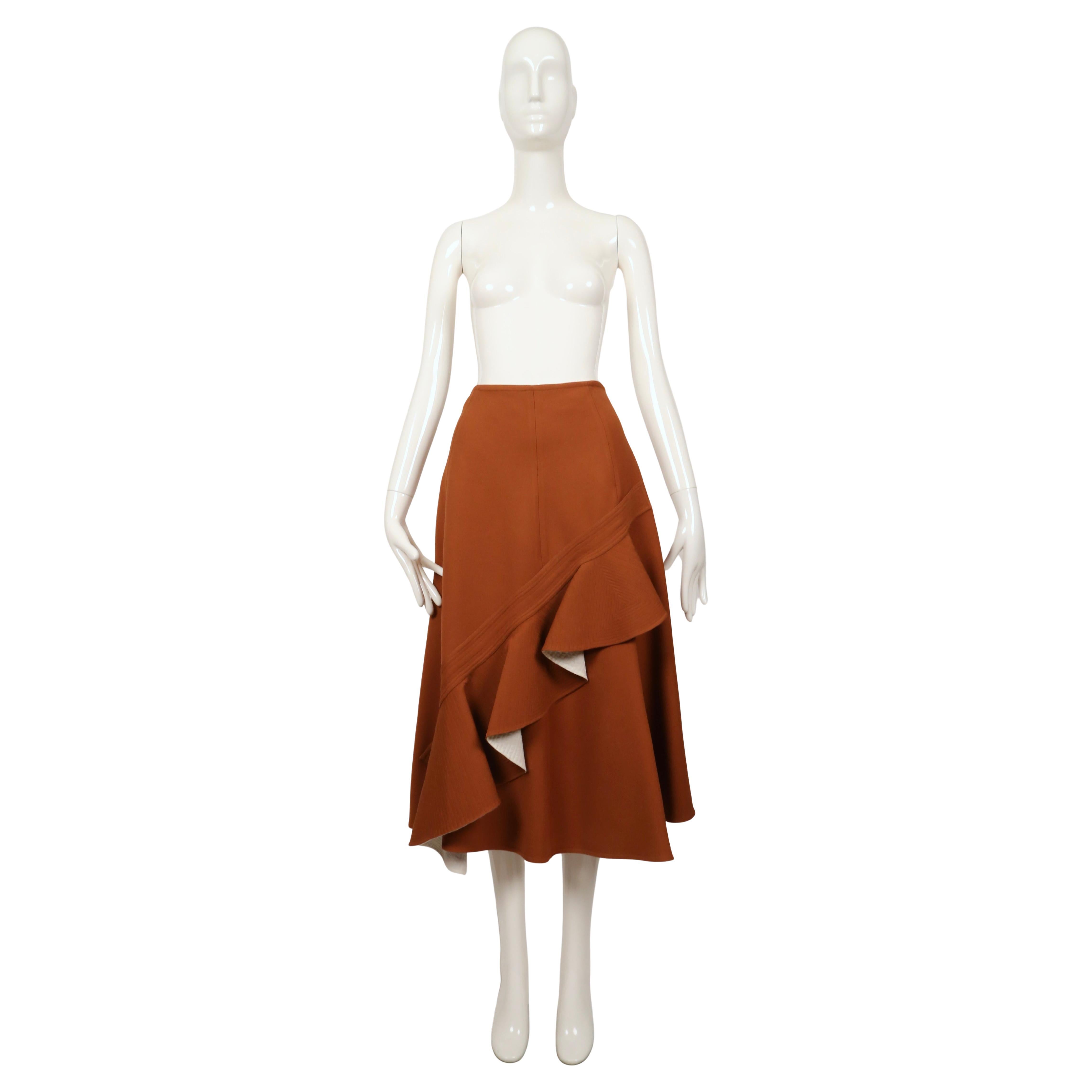 Cinnamon brown wool skirt with ruffle motif designed by Phoebe Philo for Celine. Great movement when walking. Circa 2015. French size 38. Approximate measurements: waist 27