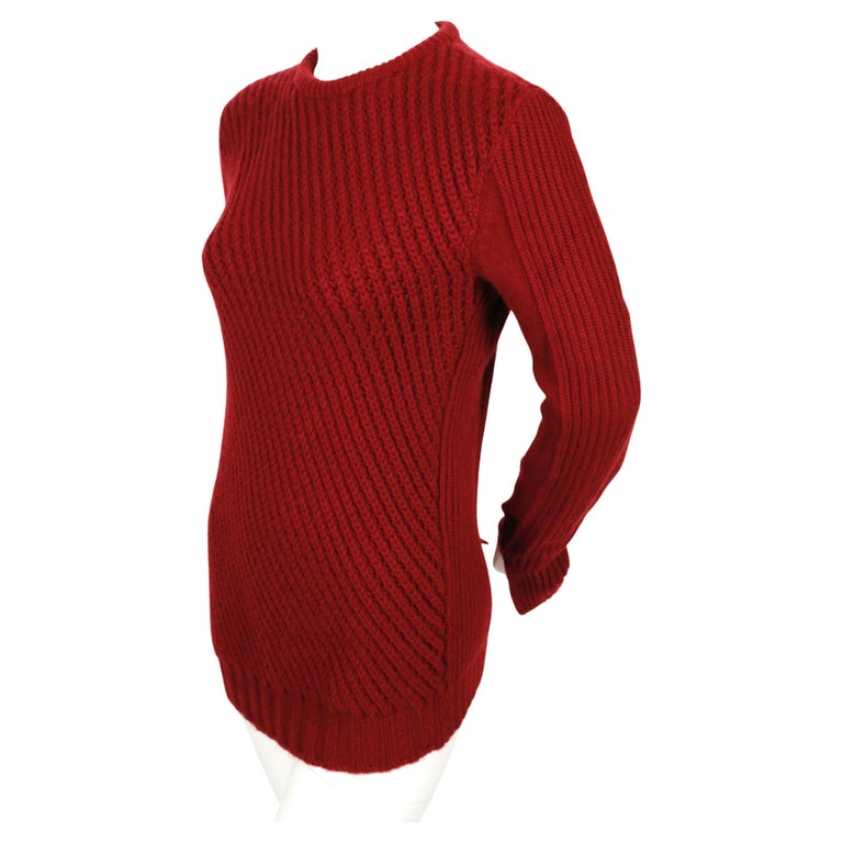 Diagonally ribbed, burgundy cashmere sweater with split cuffs designed by Phoebe Philo for Celine. Size M but also fits a S. Approximate measurements (unstretched): shoulder 15.5