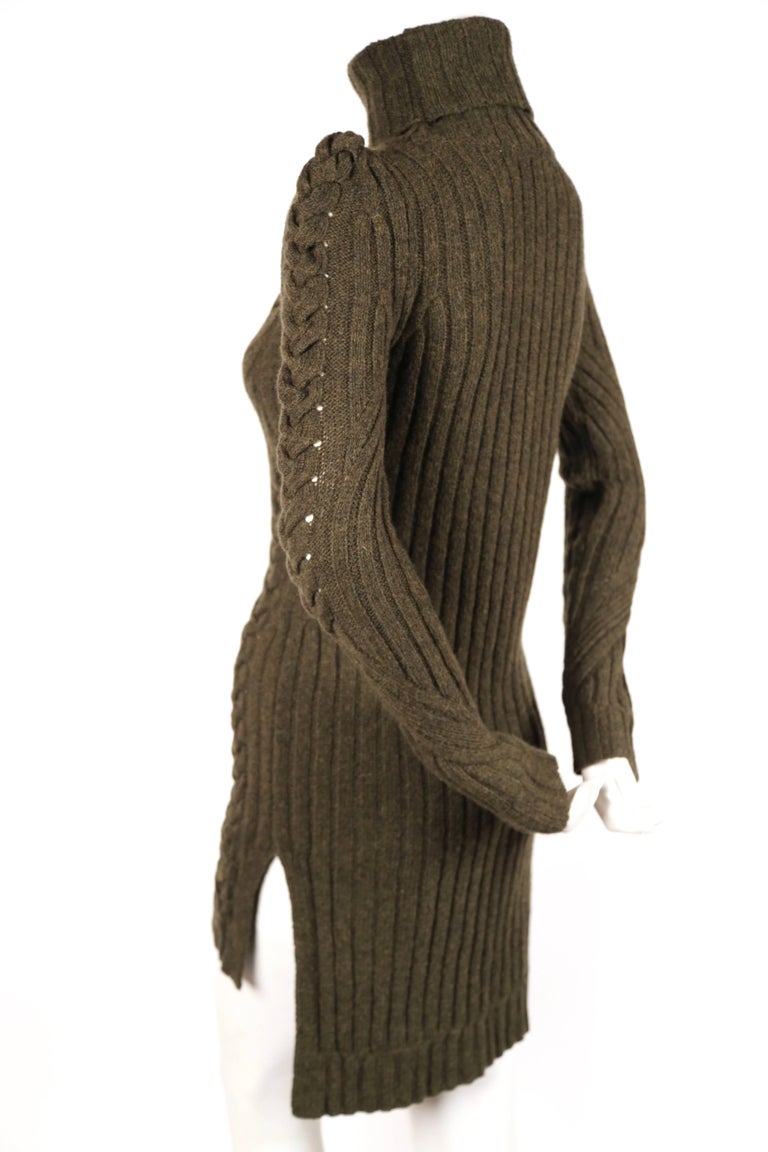 Moss Green cable-knit sweater dress designed by Phoebe Philo for Celine for the pre fall 2010 collection. Can be worn as a sweater or dress. Size S. Approximate measurements (unstretched): 15