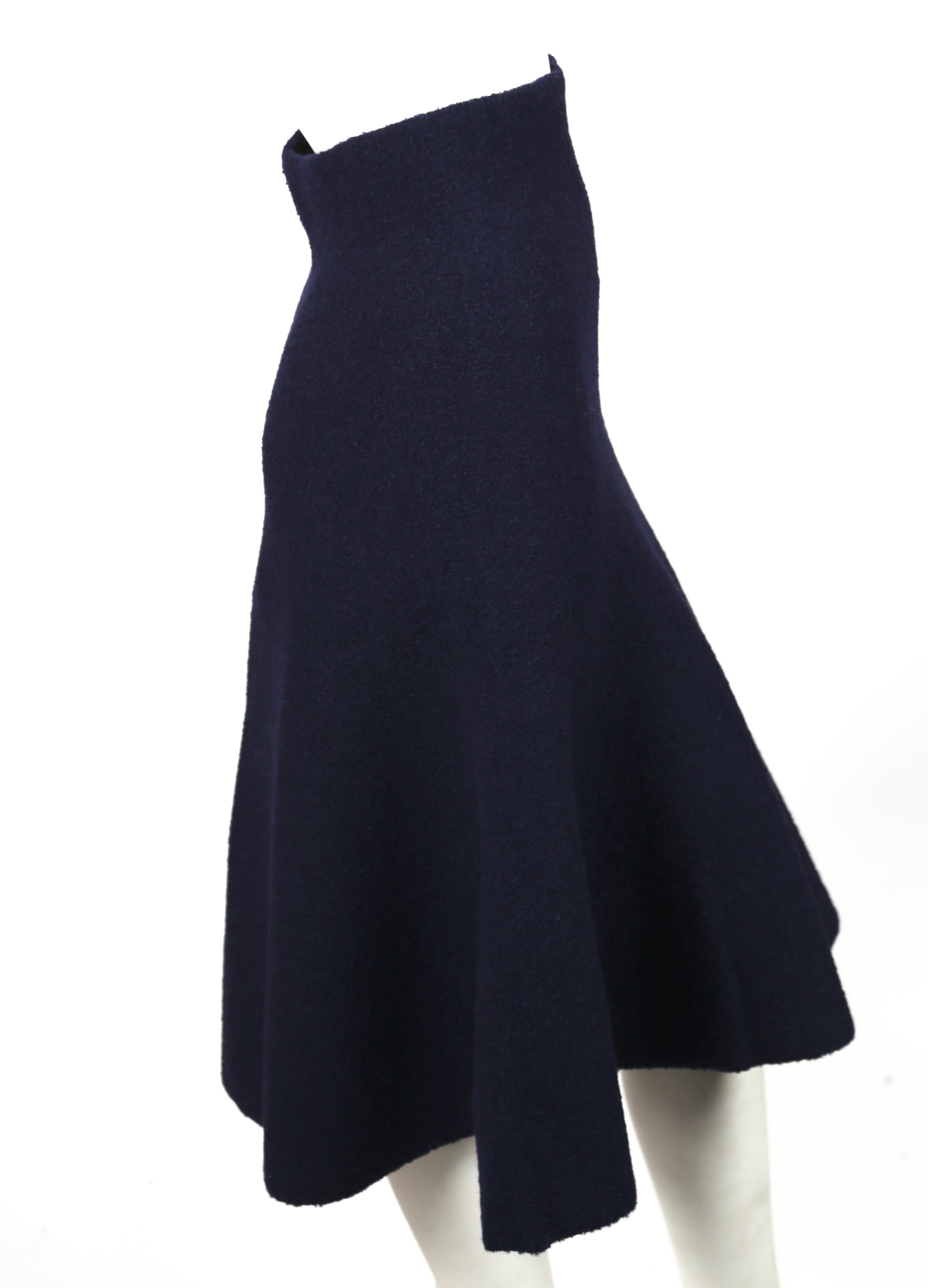 Deep navy-blue, flared knit skirt designed by Phoebe Philo for Celine exactly as seen on the runway for fall of 2013. Very flattering and comfortable fit. Labeled a French size S. Approximate measurements (unstretched) : 26